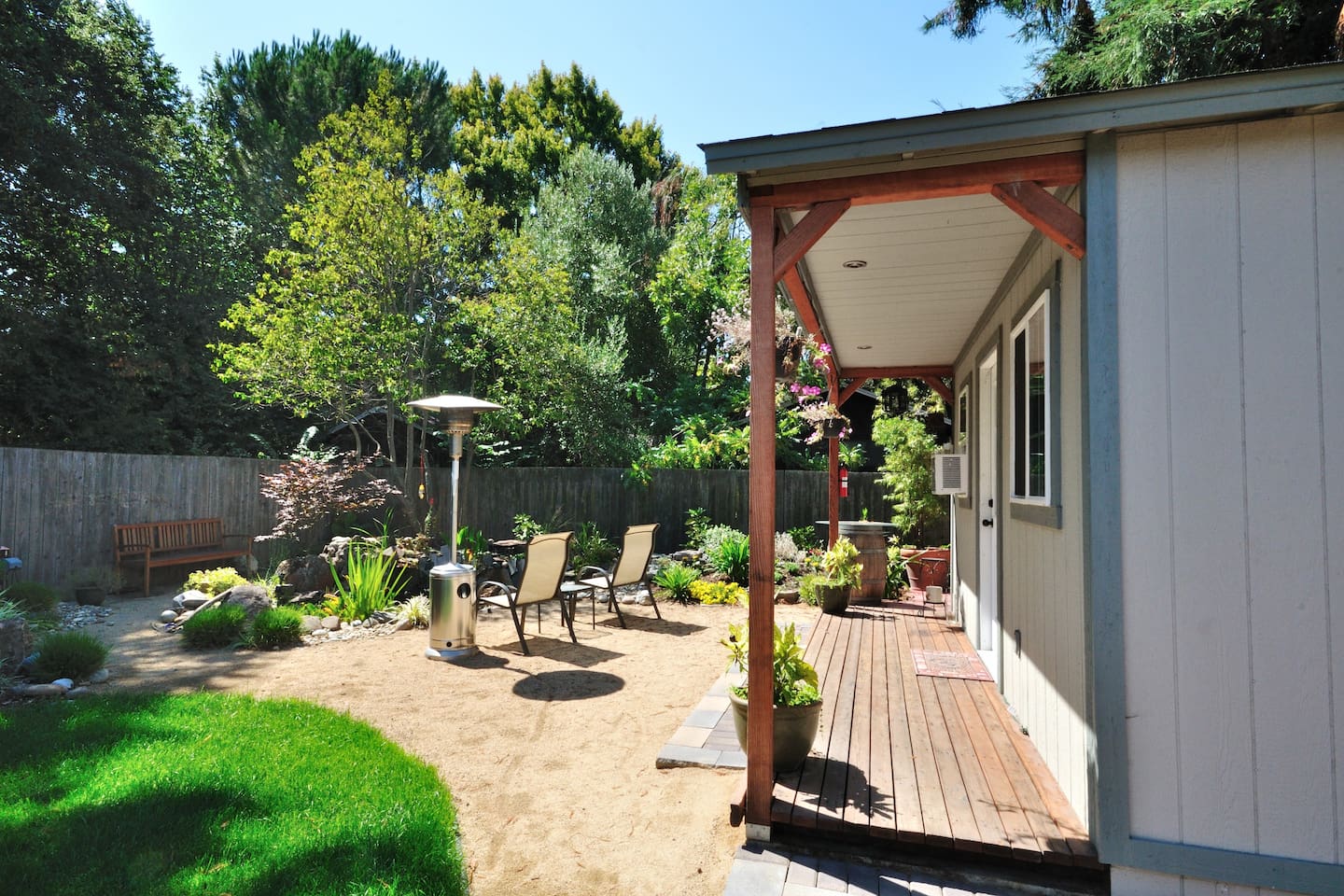 Shaded garden walkway leading to a cozy entrance
