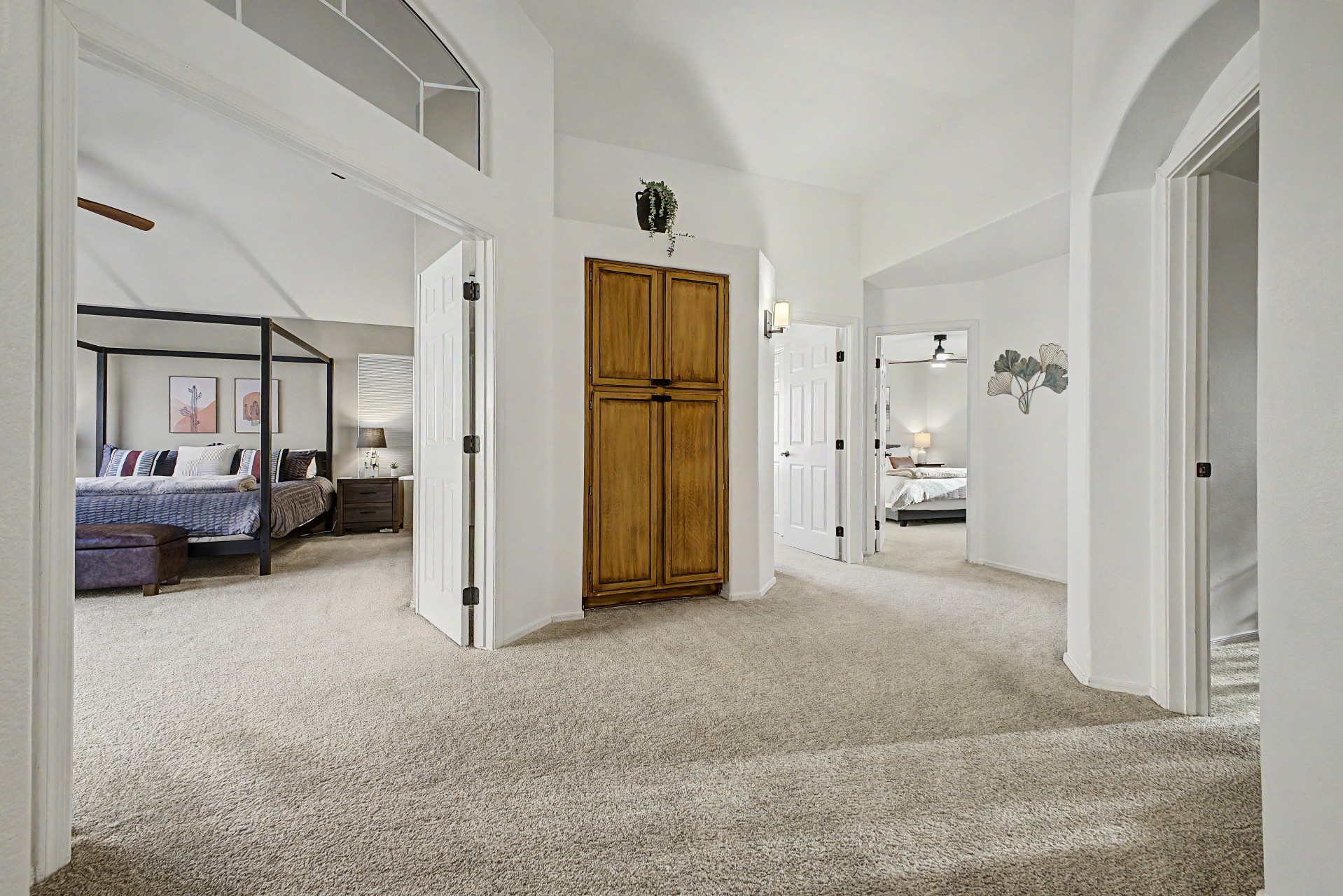 Upstairs Hallway: Spacious layout connecting beautiful bedrooms in a serene retreat. 