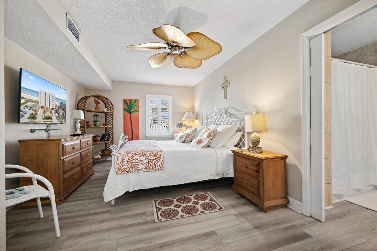 Downstairs primary bedroom with king bed and private bath