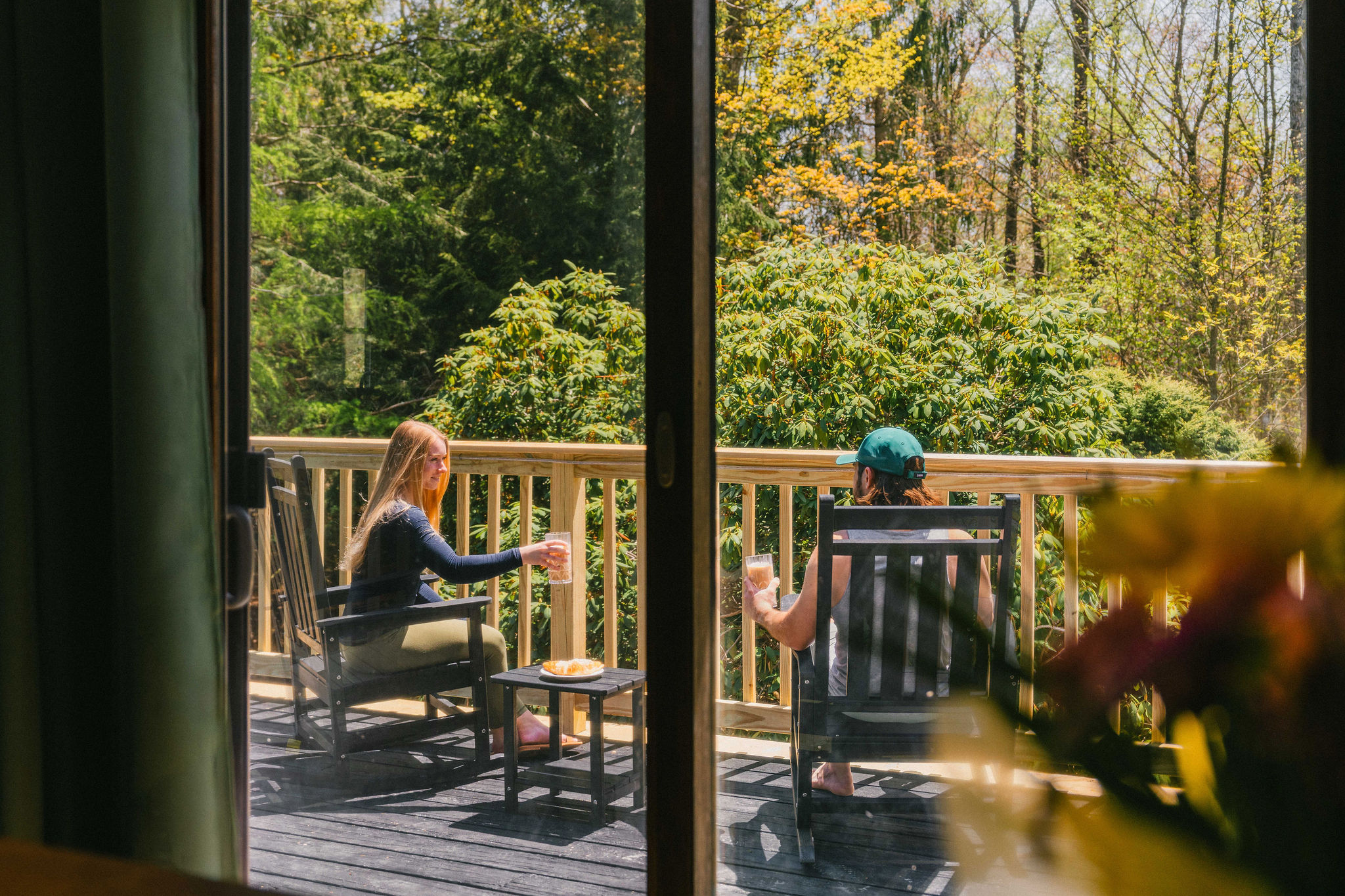 🪑 Hanging egg chairs and rockers — the deck's best seat in the house.