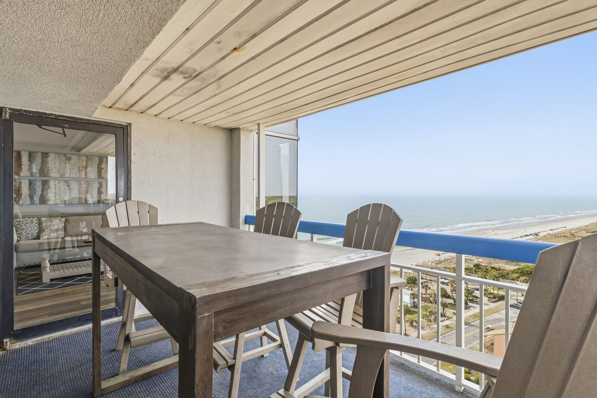 Balcony dining table with ocean and beach views