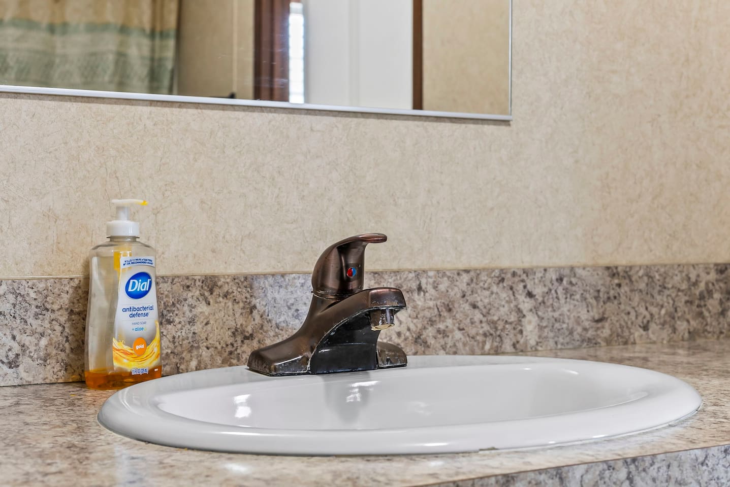 Detailed view of the sink and countertop, offering a clean and practical space for everyday use.
