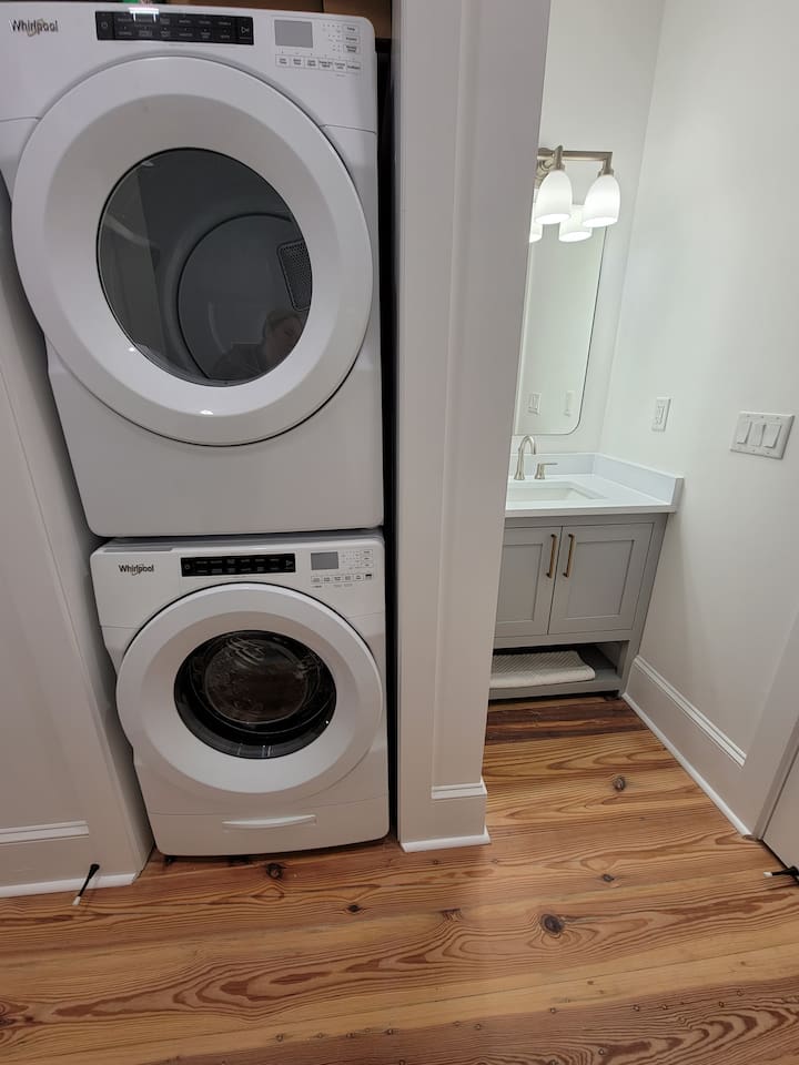 Full size washer and dryer located in the bathroom. 
