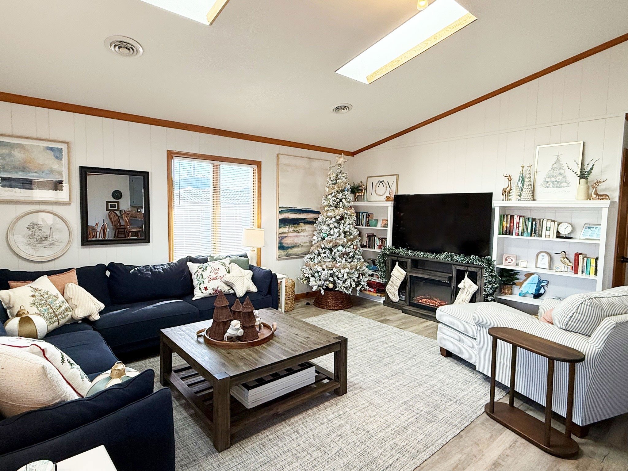 Decorating for Christmas is one of our favorite holiday traditions!  We love making our home extra special this time of year.  A cozy electric fireplace creates the perfect setting for festive