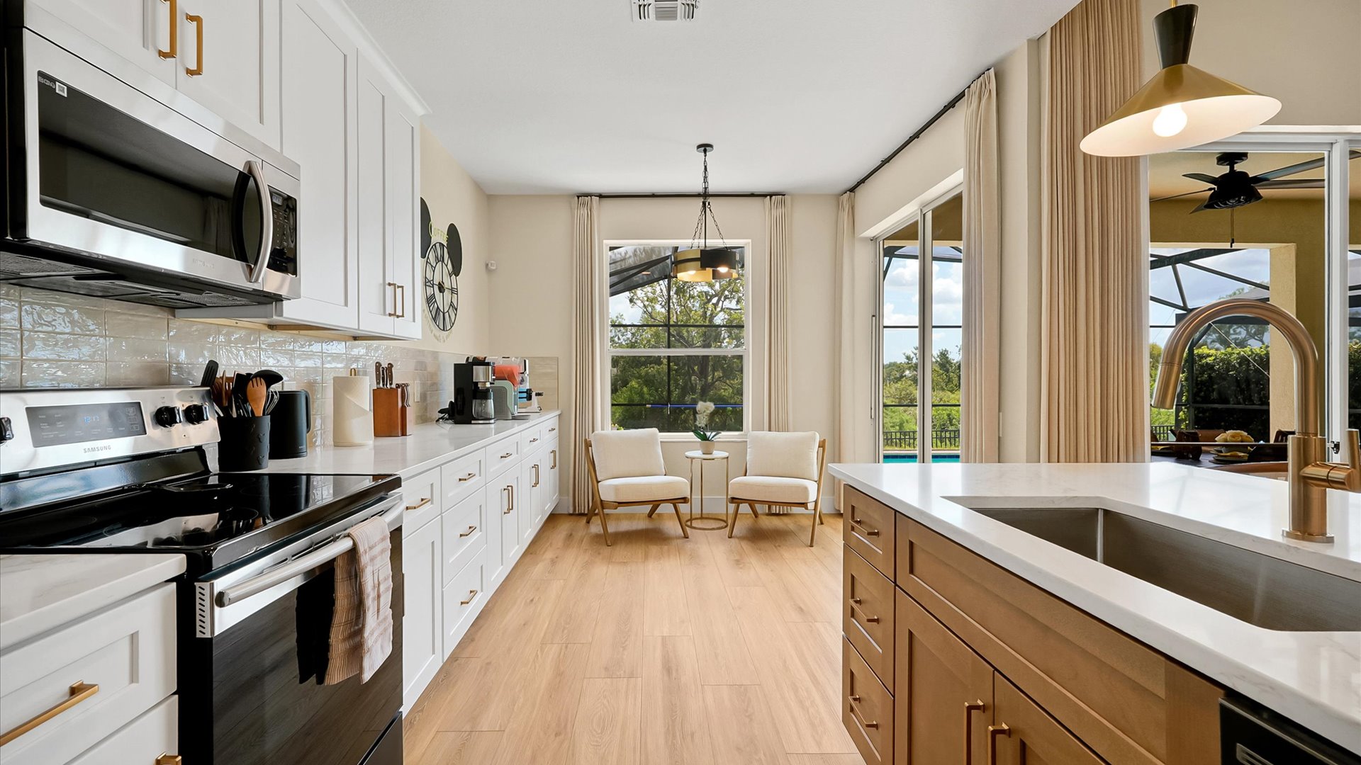 itchen: Fully renovated kitchen with abundant cabinetry, expansive counters, modern appliances and a large island.