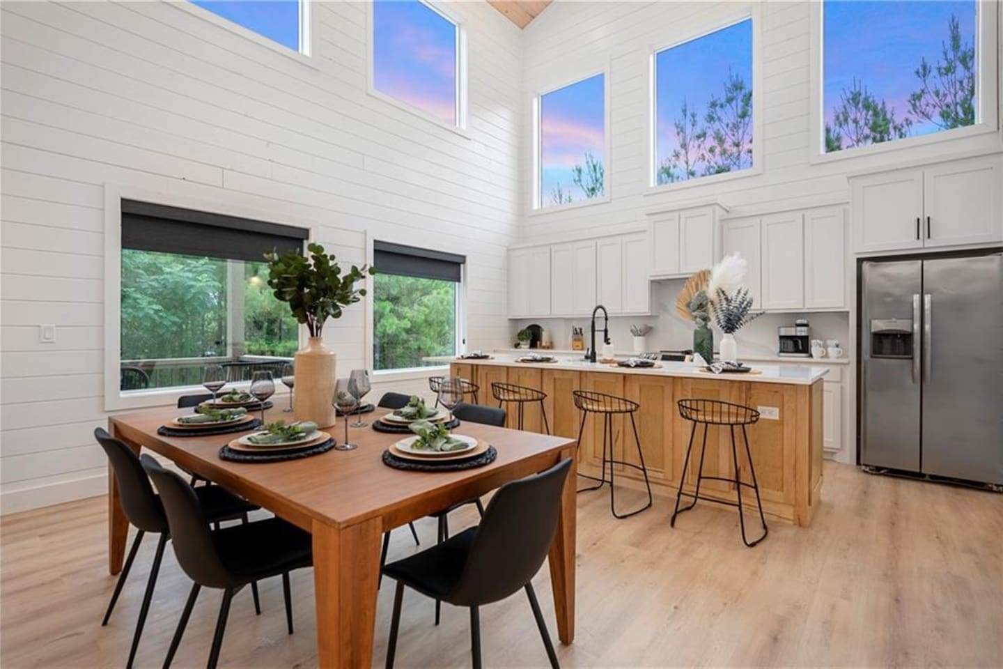 The dining space flows seamlessly from the kitchen, perfect for effortless meals and heartfelt moments.
