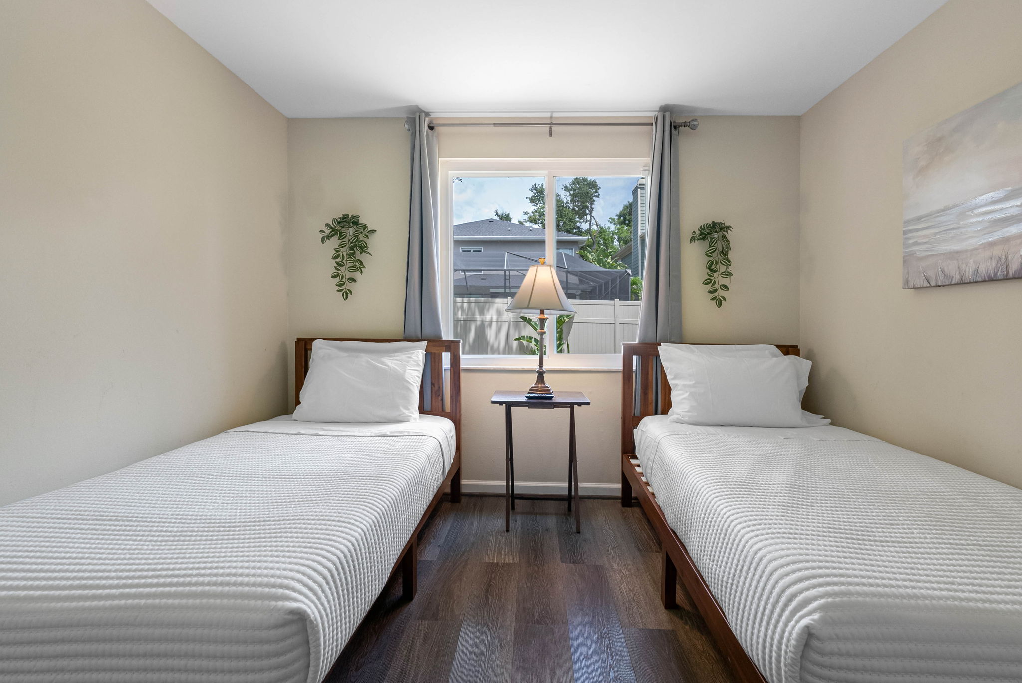 Perfect for guests seeking comfort, charm, and a bit of personal space, this thoughtfully designed bedroom features two cozy twin beds.