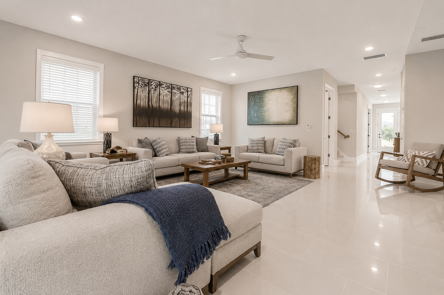There's room for the whole happy crowd here—grandparents, cousins, and all—spread across generous sofas with stories flowing late into the night. Open, bright, and endlessly comfortable, this great room was simply made for being together.