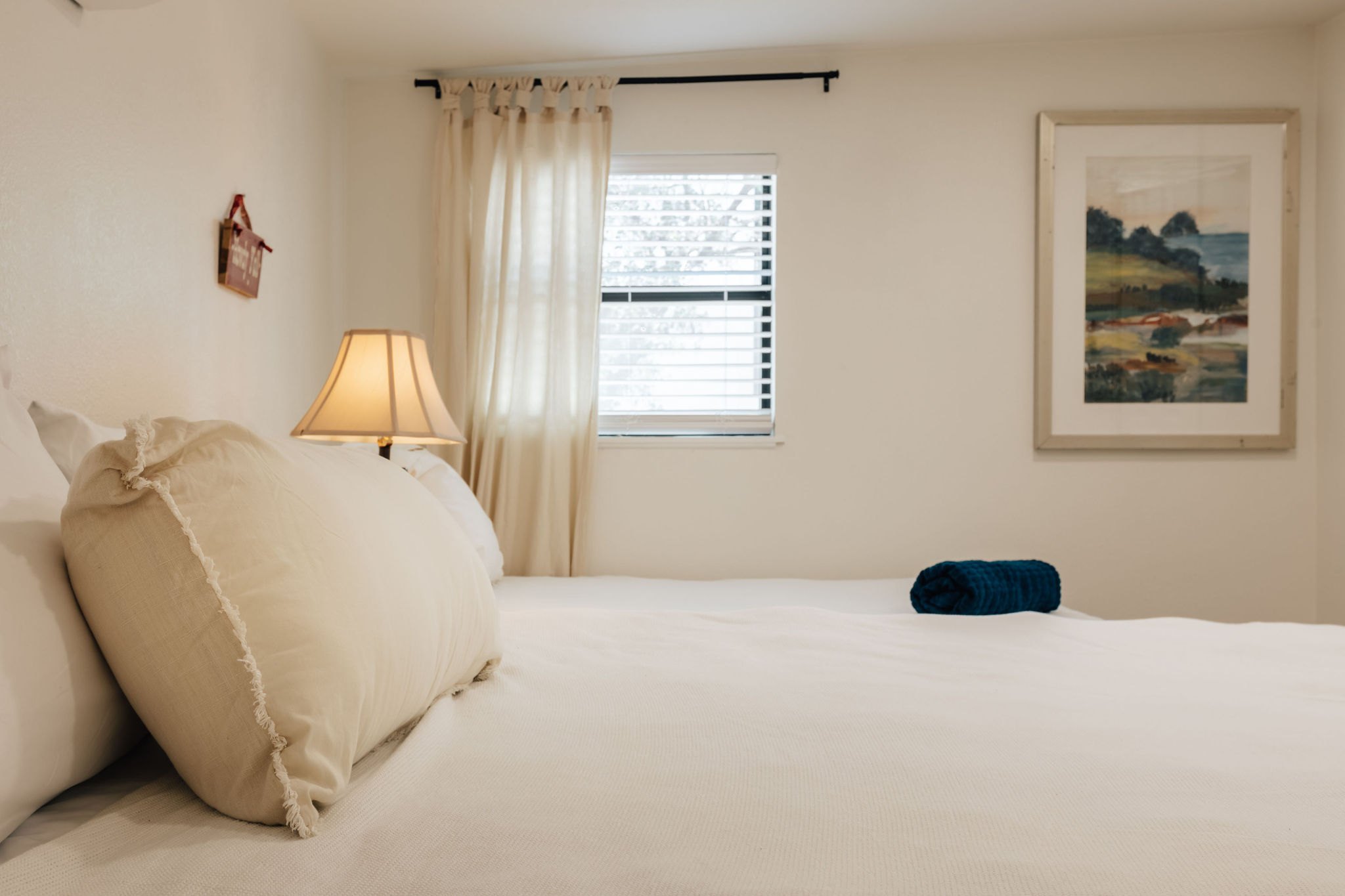 comfy king bed plus a single bed in bedroom