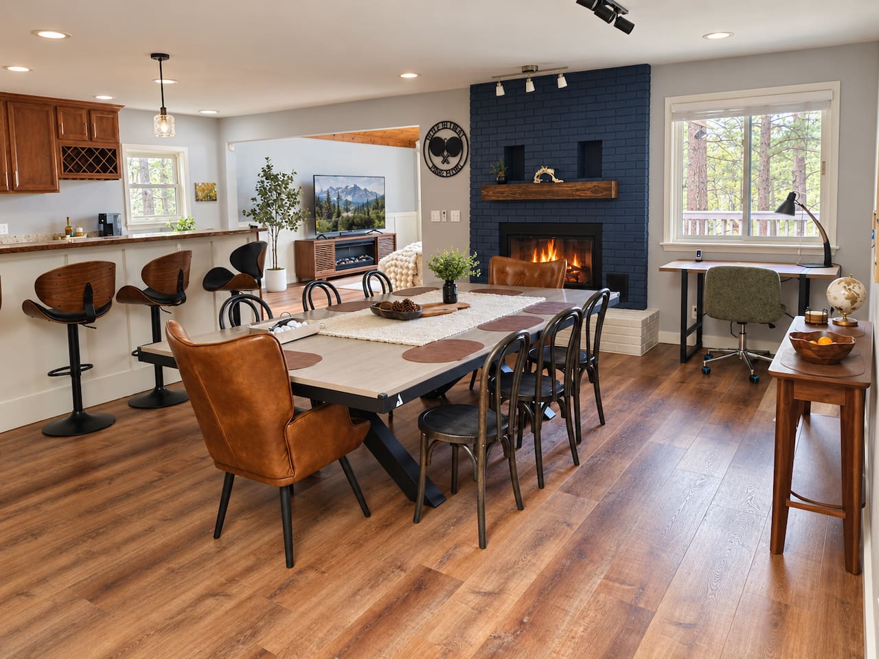 Gather around the full-size dining table with seating for up to 12, use it as a spacious buffet for group meals, or add the net to convert it to a full-size ping-pong table for some friendly competition. Plus, 4 additional seats at the bar.
