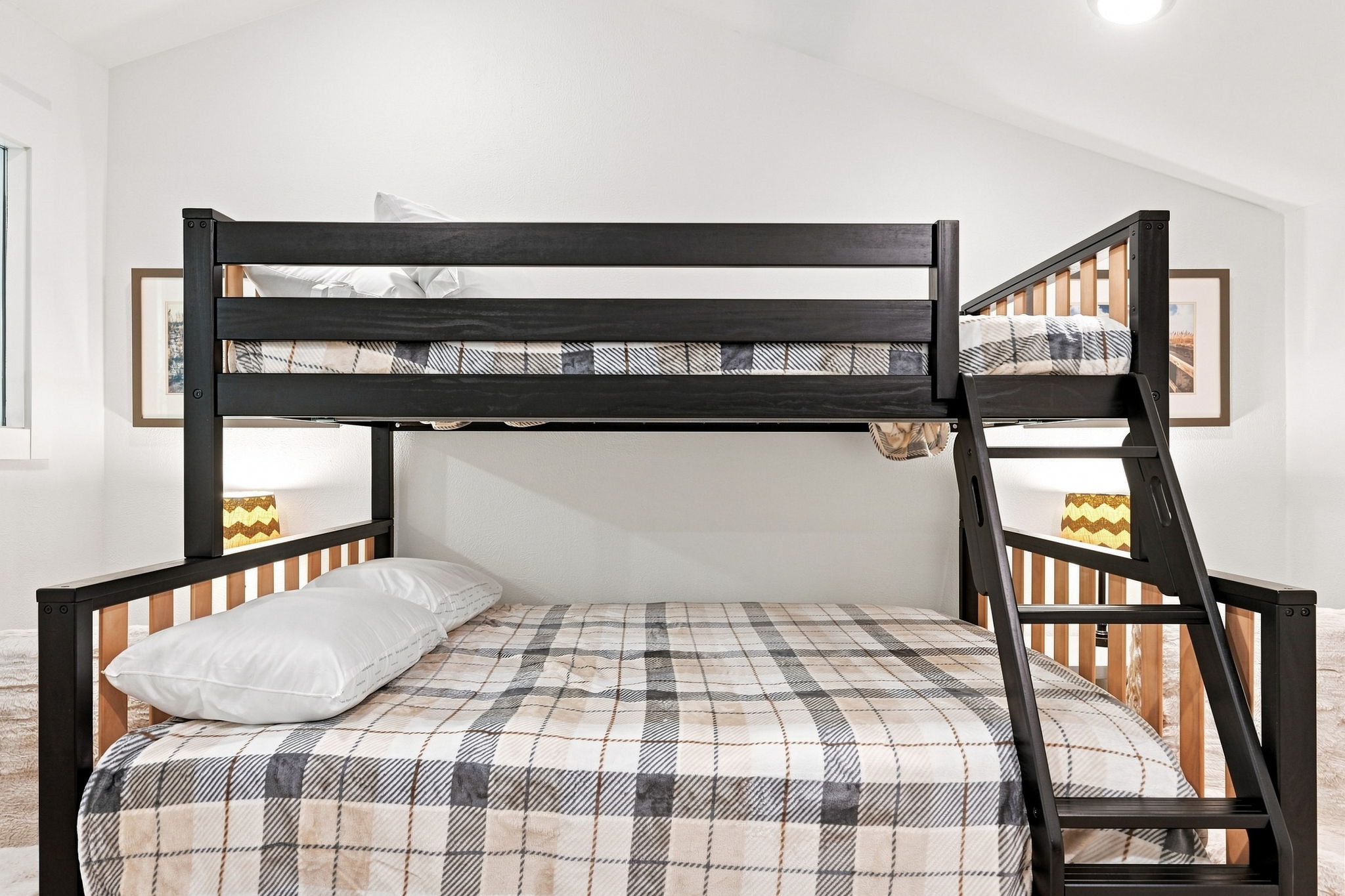 Comfortable, inviting bedding brings a warm and relaxing feel to this coastal bedroom—just right for settling in and staying awhile.