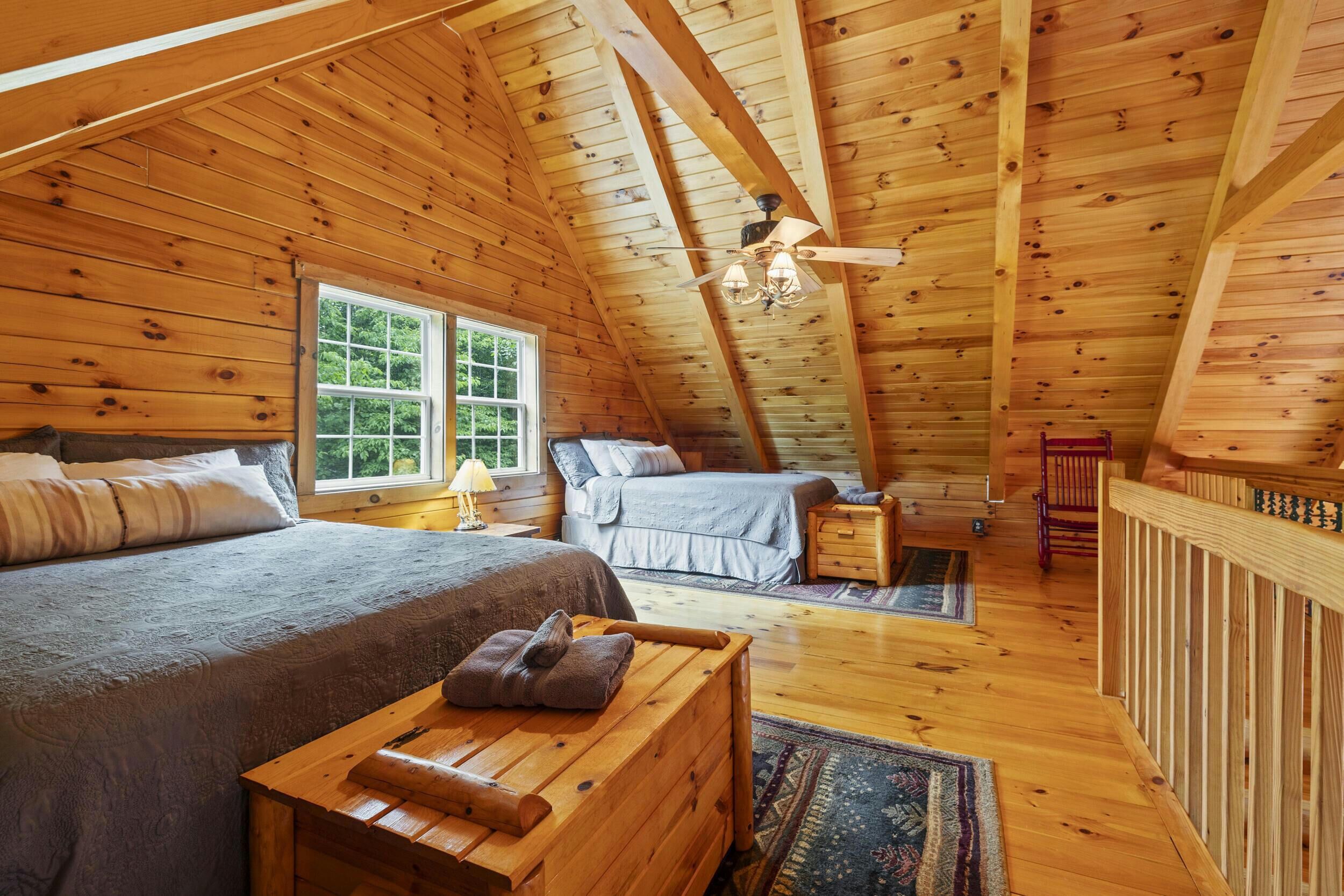Loft bedroom with two comfy queen beds.