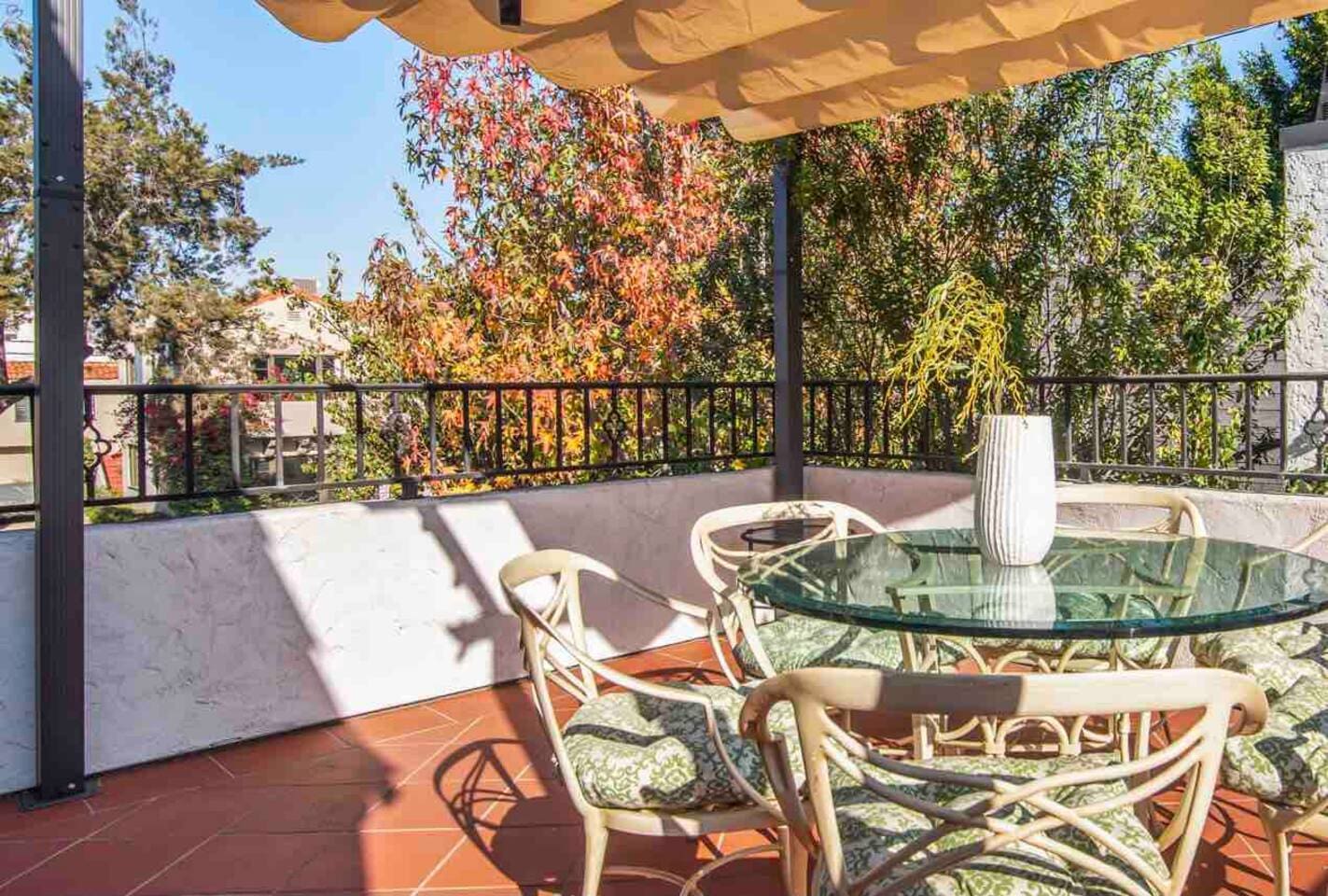 This private  terrace has beautiful treetop views. 