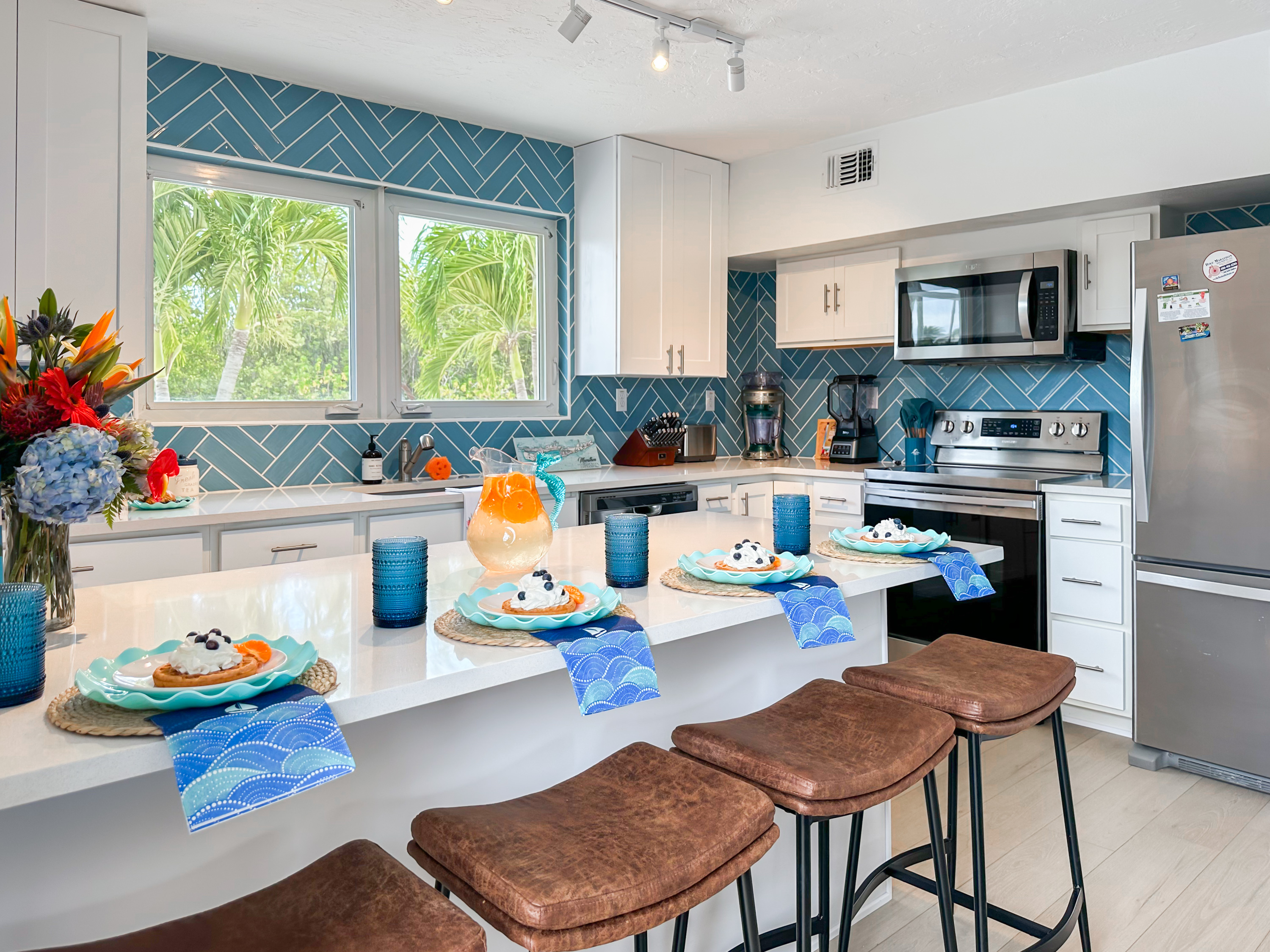 This fully stocked kitchen and stainless steel appliances make cooking easy!