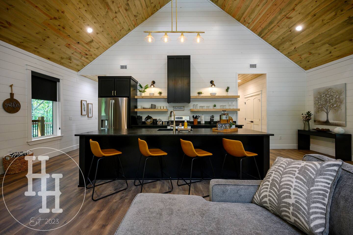 Our large island is complete with a sink and four bar stools. 