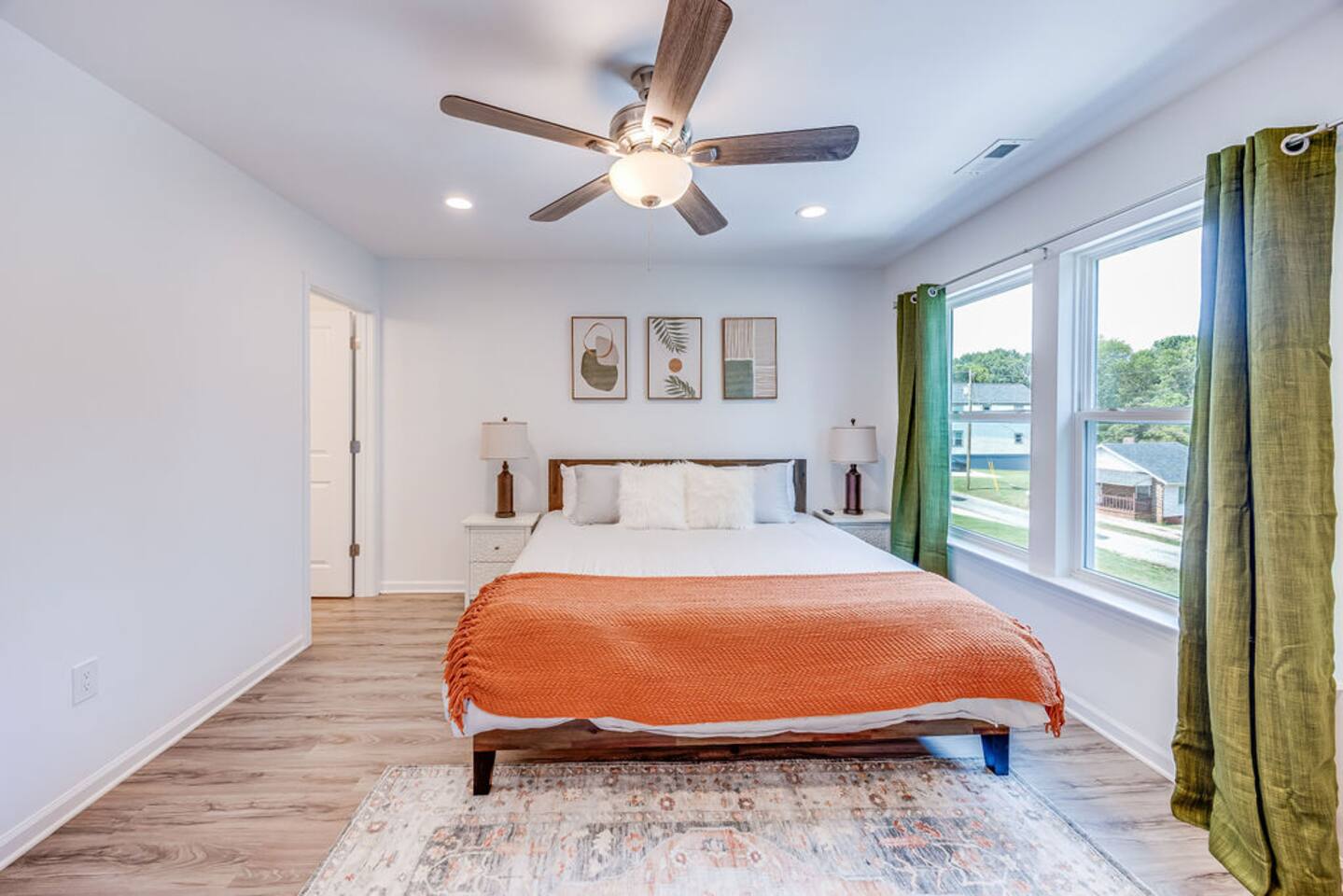 Relax in the spacious bedroom featuring a comfortable king bed, with a private master bathroom attached for added convenience and comfort.