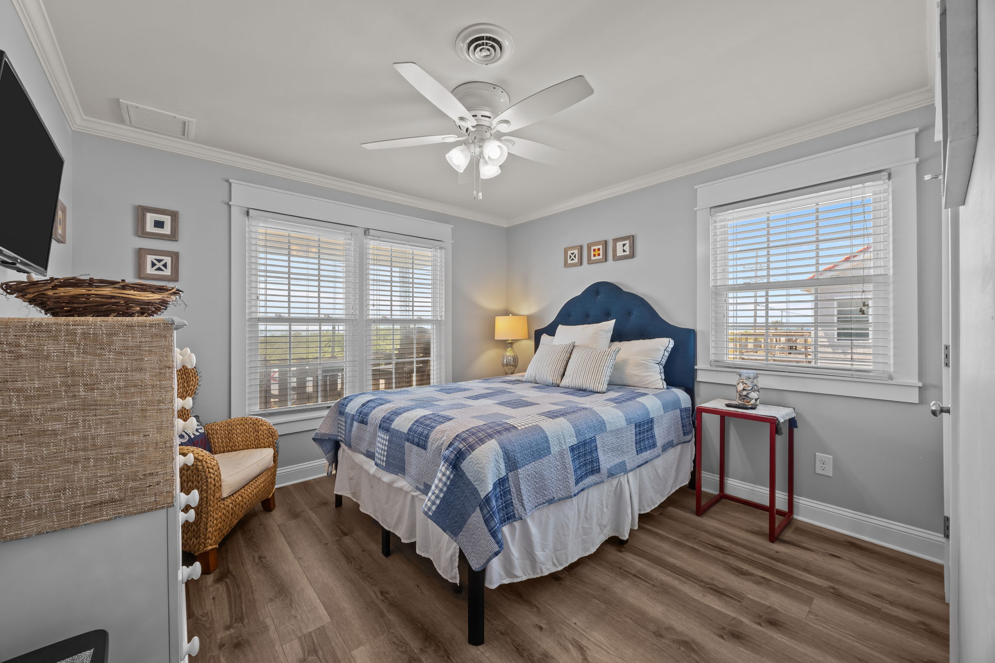 Modern touches and coastal charm in the additional queen bedroom