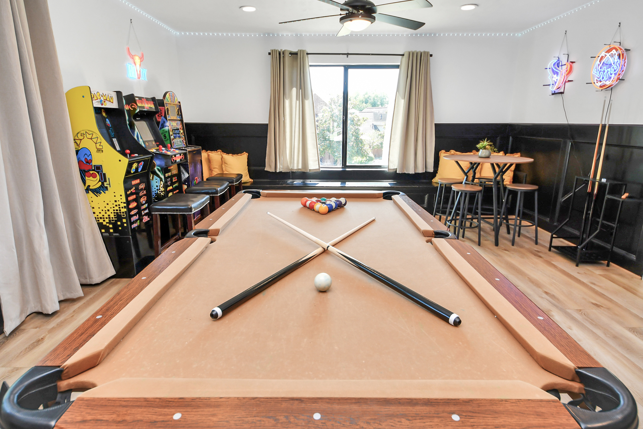Game room upstairs that is sure to please the whole crowd! Play billiards, watch TV, play one of the 3 arcade machines or play one of the many board games that are available!