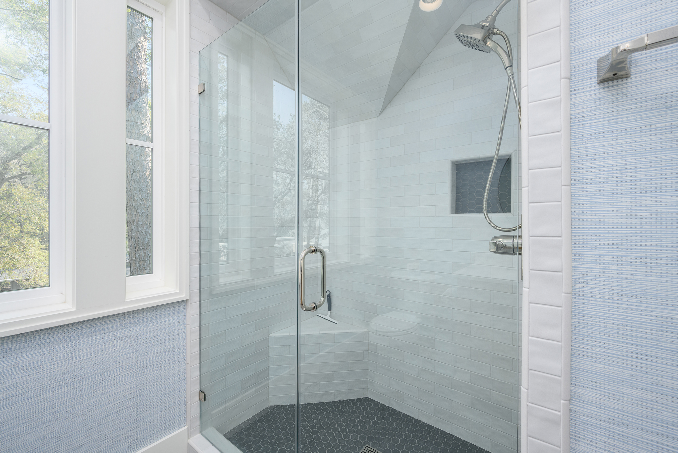 Upstairs front corner bedroom bathroom shower with bench seat