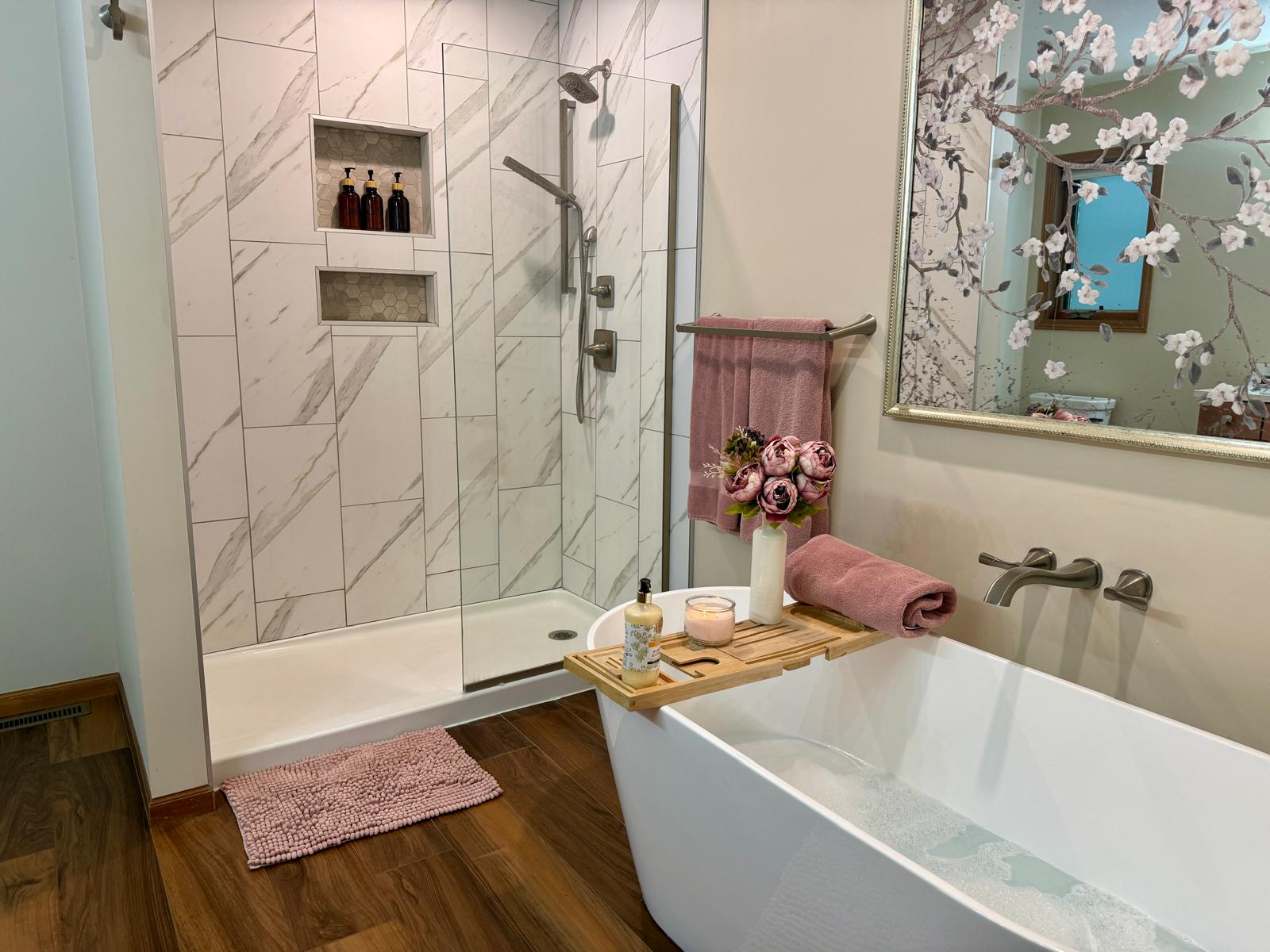 Gorgeous soaking tub on main level, and shower, in primary bathroom
