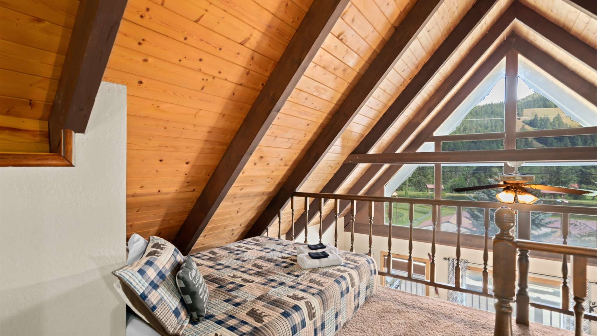 Wake up to views of the treetops from the loft’s private balcony.