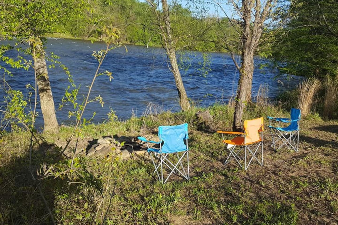 Bring your camp chairs, hammocks, and fishing poles to spend time down by the river
