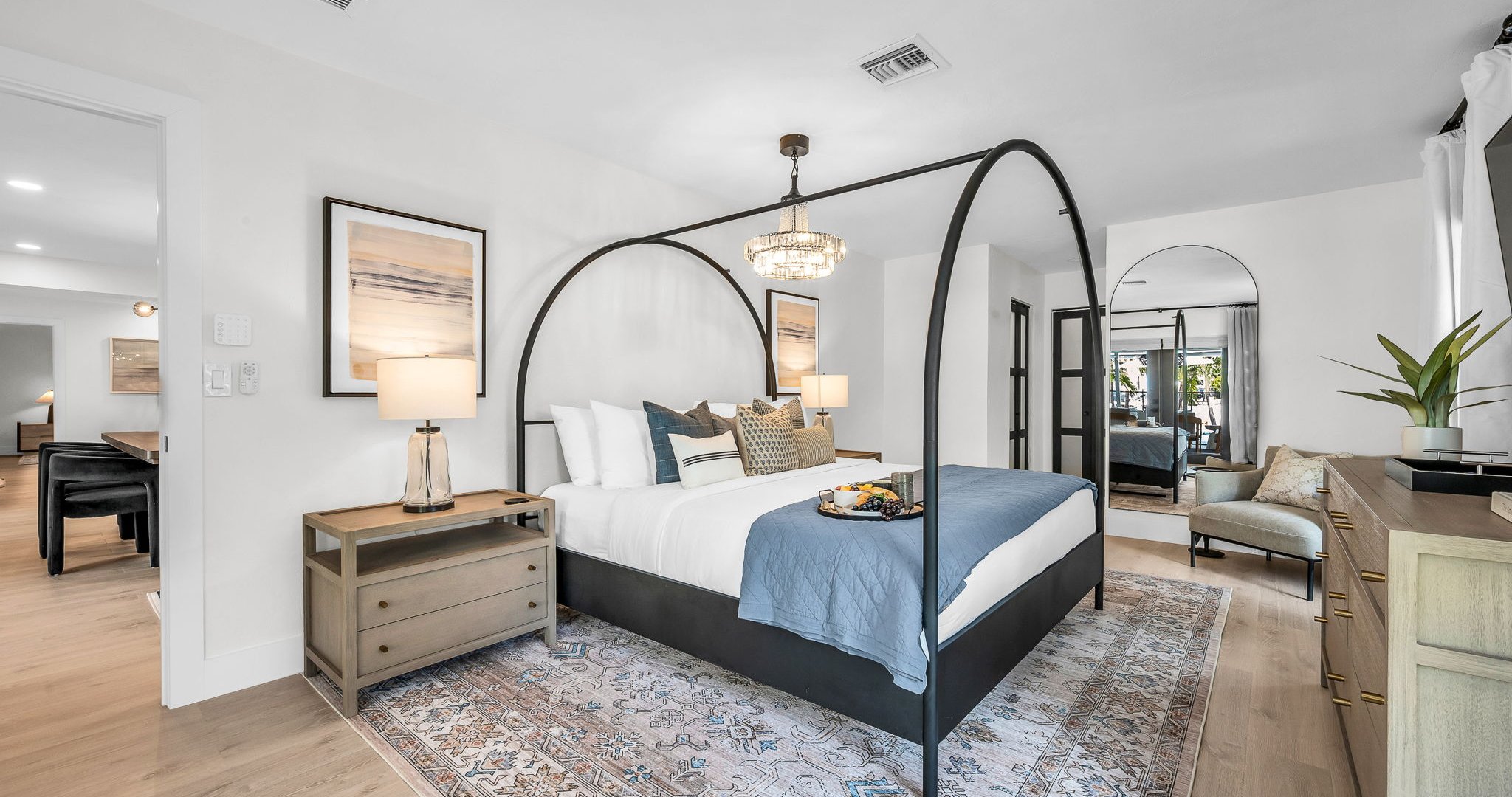 This second primary suite offers a plush king bed, private ensuite bathroom, and walk-in closet for added comfort. Enjoy poolside views and direct access to the outdoor living area, making it the perfect blend of luxury and convenience.
