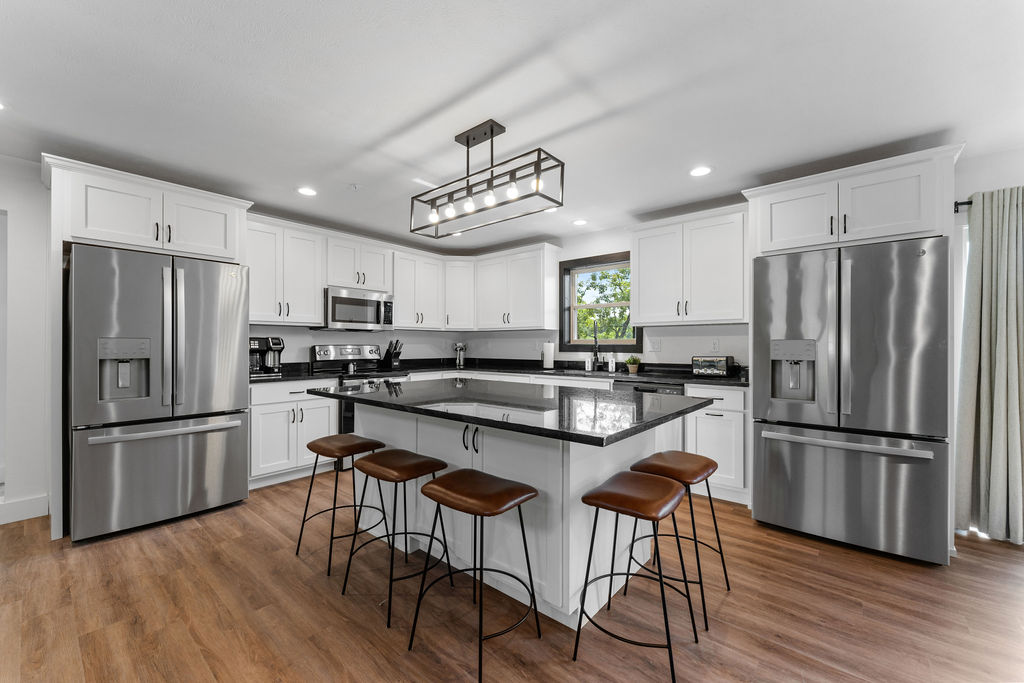 Well-appointed kitchen with stainless appliances and bar seating