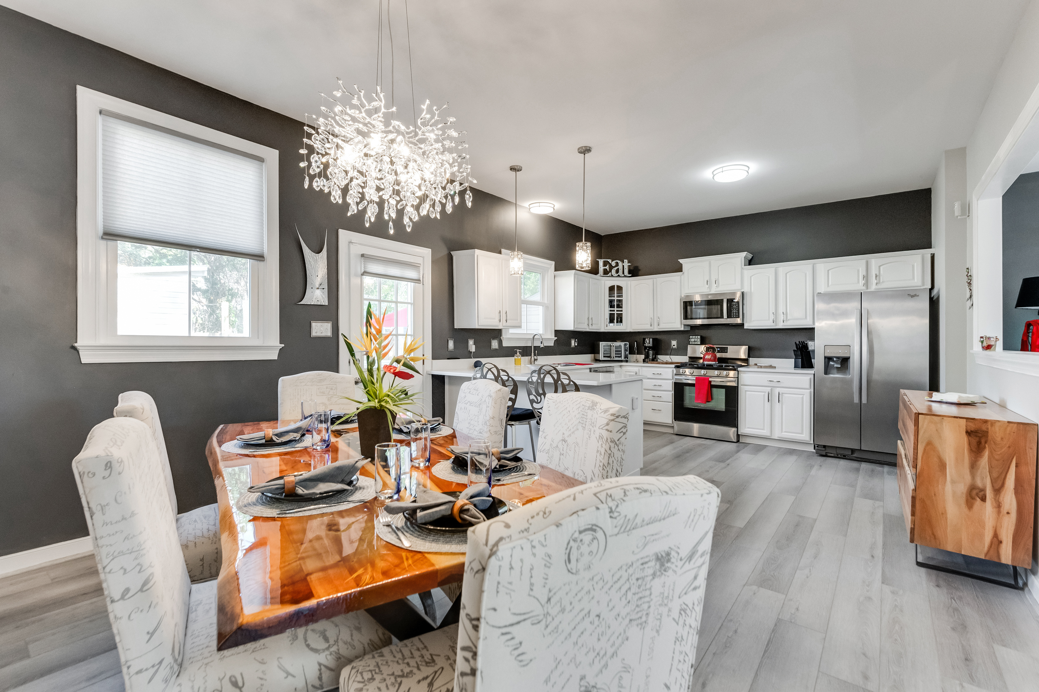 Dining Room: Gather around a stylish table under a sparkling chandelier for unforgettable meals!