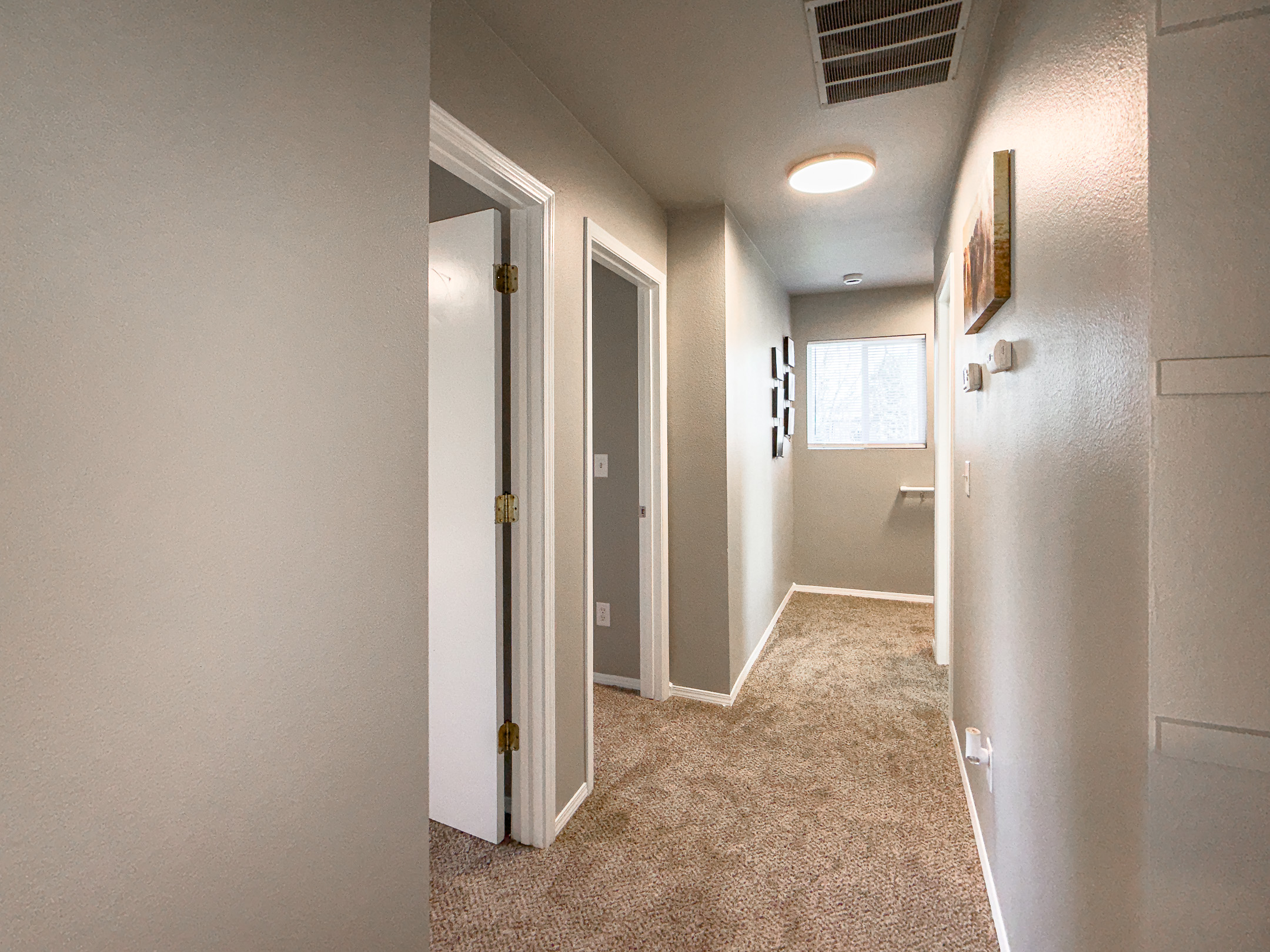 3006 Regan – Hallway connecting bedrooms and bathrooms.
