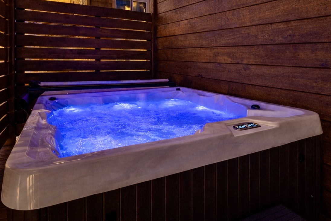 Relax in your private covered hot tub any time