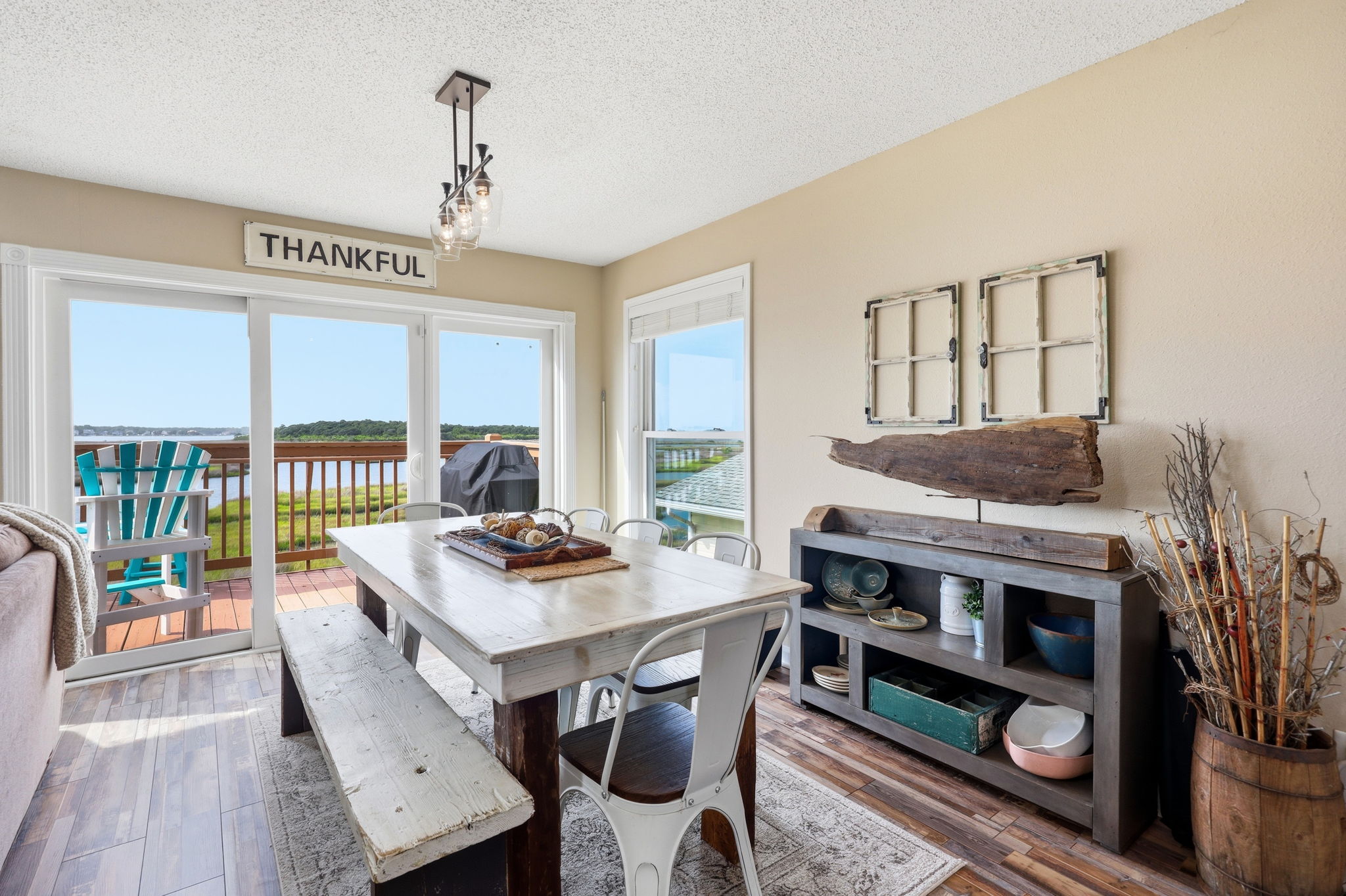 Enjoy indoor dining with a coastal view and easy access to outdoor grilling.