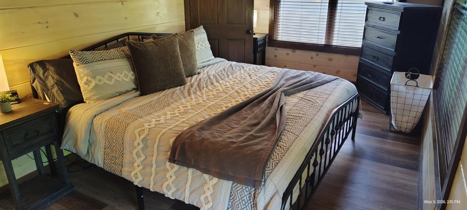 Primary Suite Main Level. King bed, Private bath and access to the entertainment deck