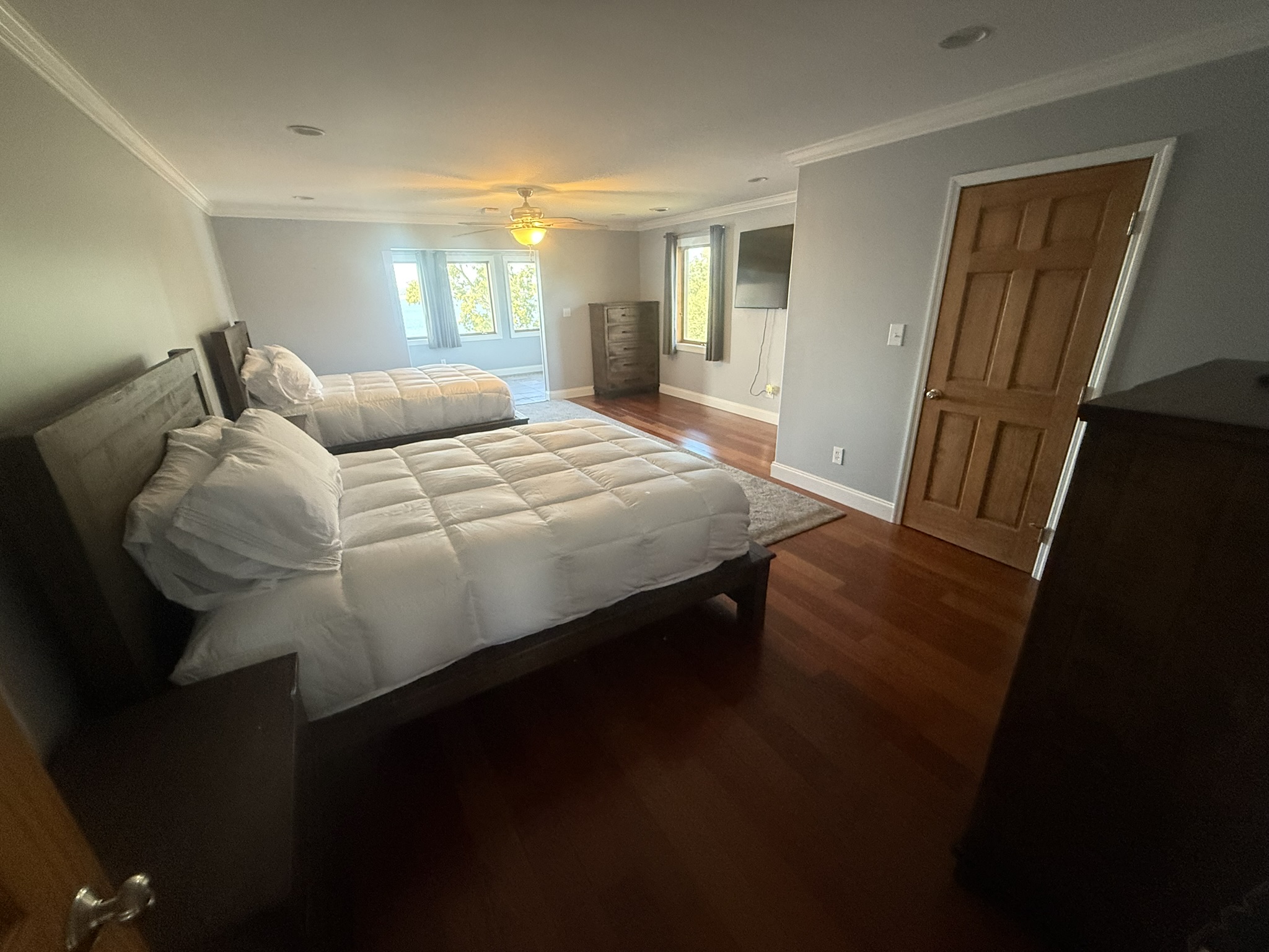Bedroom 2 with 2 queen beds and a beautiful view of the lake through the bridal room