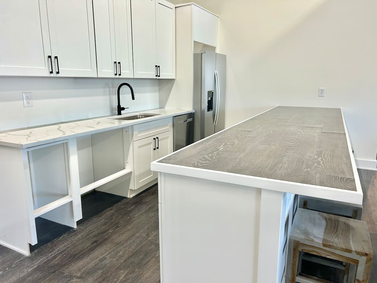 The shared community clubhouse includes a modern kitchenette area, perfect for preparing a quick snack while enjoying the common spaces.