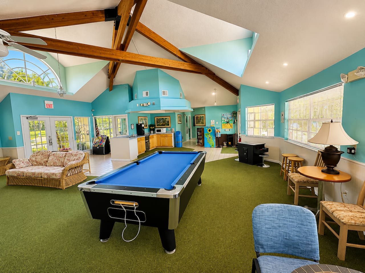 Community clubhouse with a pool table and a comfortable seating area.