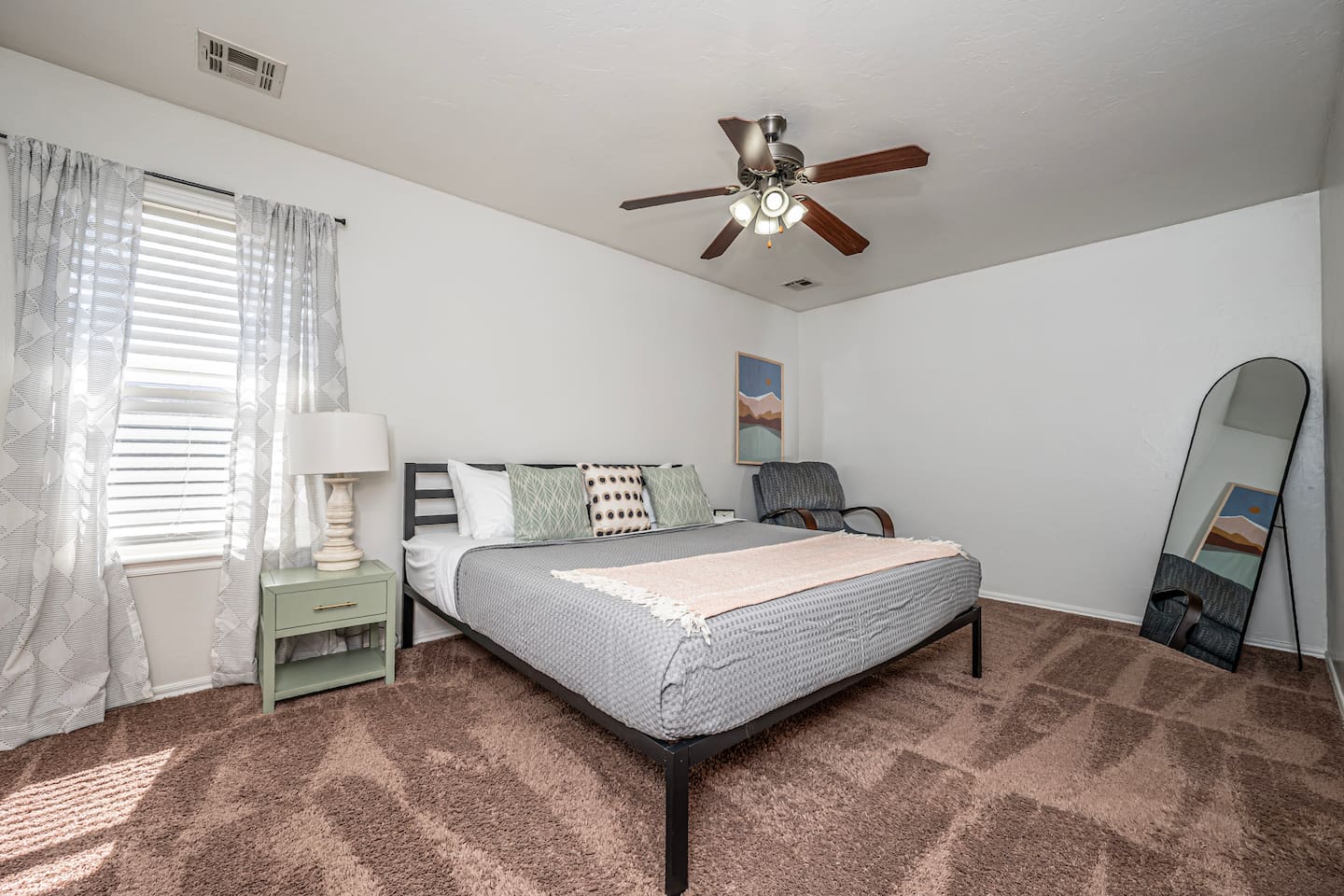 Unwind in your private retreat—master bedroom with a plush king bed.