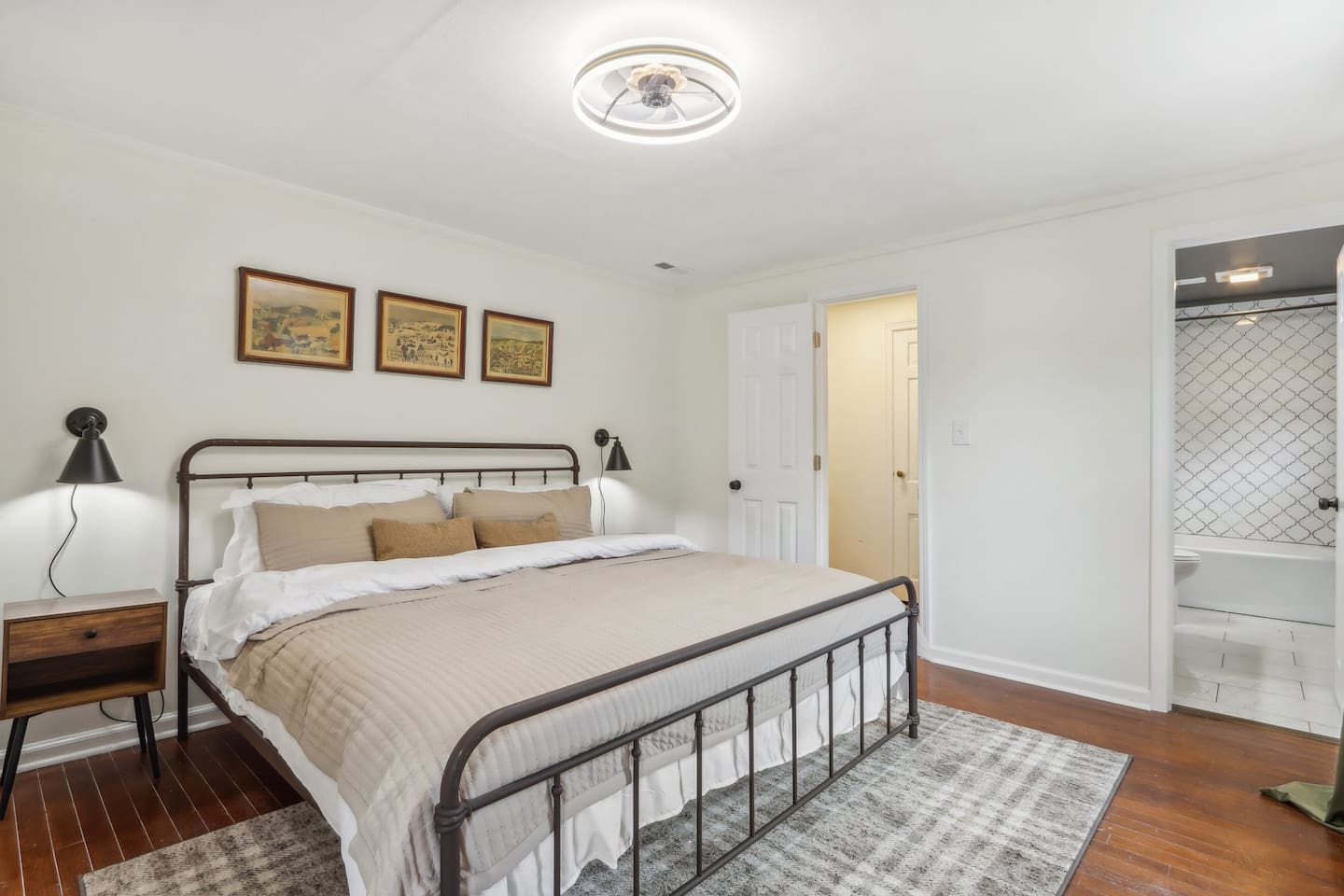 Bedroom 1 offers a spacious king-size bed and a bright, uncluttered atmosphere, perfect for unwinding after a full day.