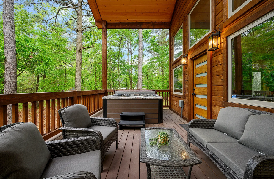 Cozy outdoor lounge with hot tub and peaceful woodland surroundings