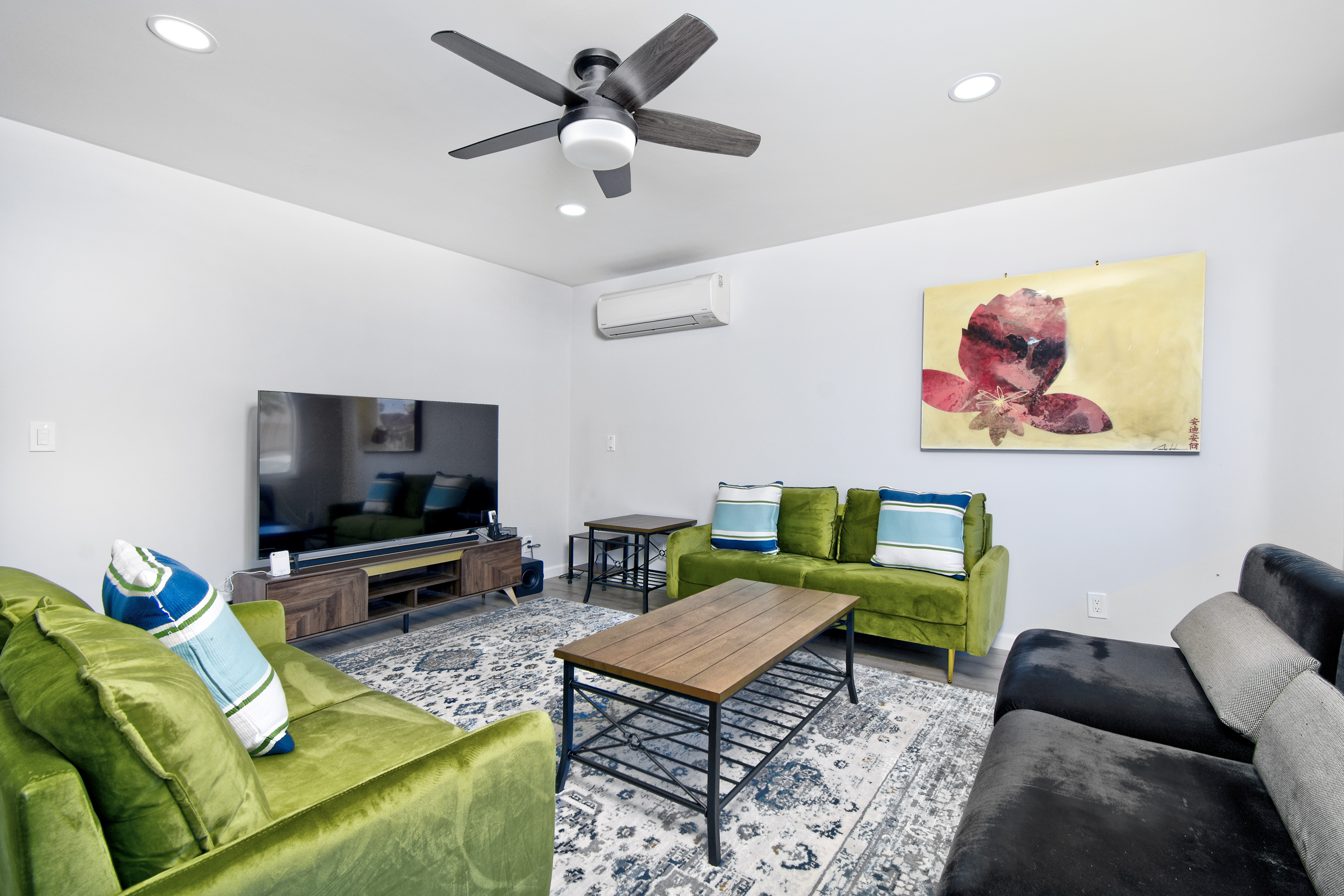 1362-shortridge-unit-a-furnished-living-room-with-green-sofa