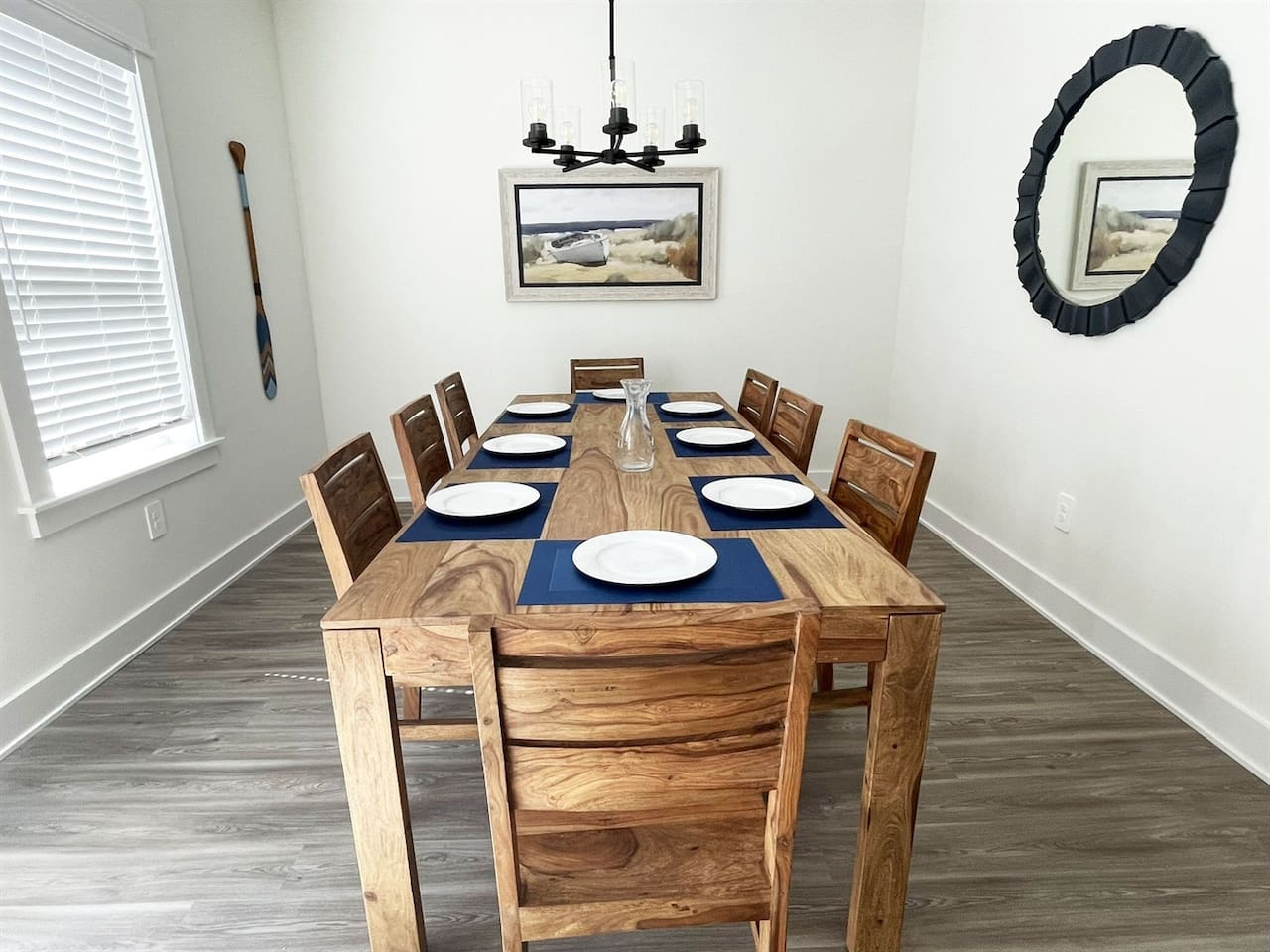 Gather around the spacious dining table with seating for family meals, game nights, or planning your beach adventures.