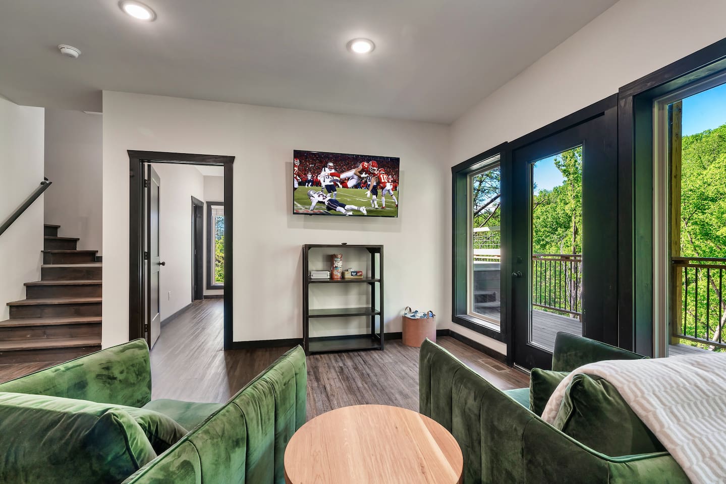 Cozy downstairs sitting area with Smart TV and direct access to the private deck.