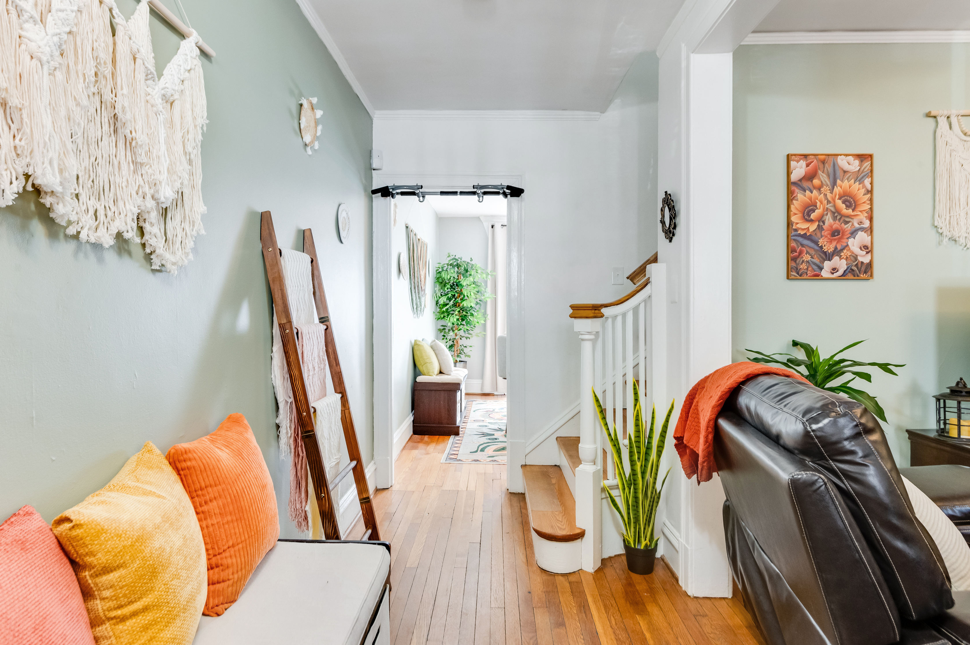 Welcoming Entryway: Bright decor, plush accents, and charming details invite you to explore!