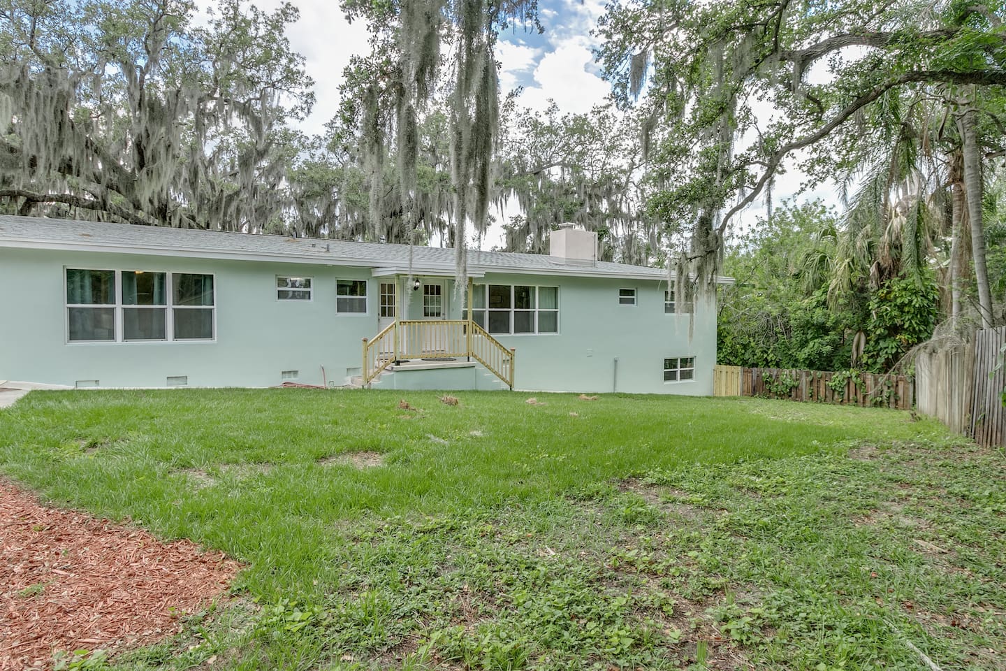 Back Yard and Two Back Entries into House (Laundry and Living Room)
