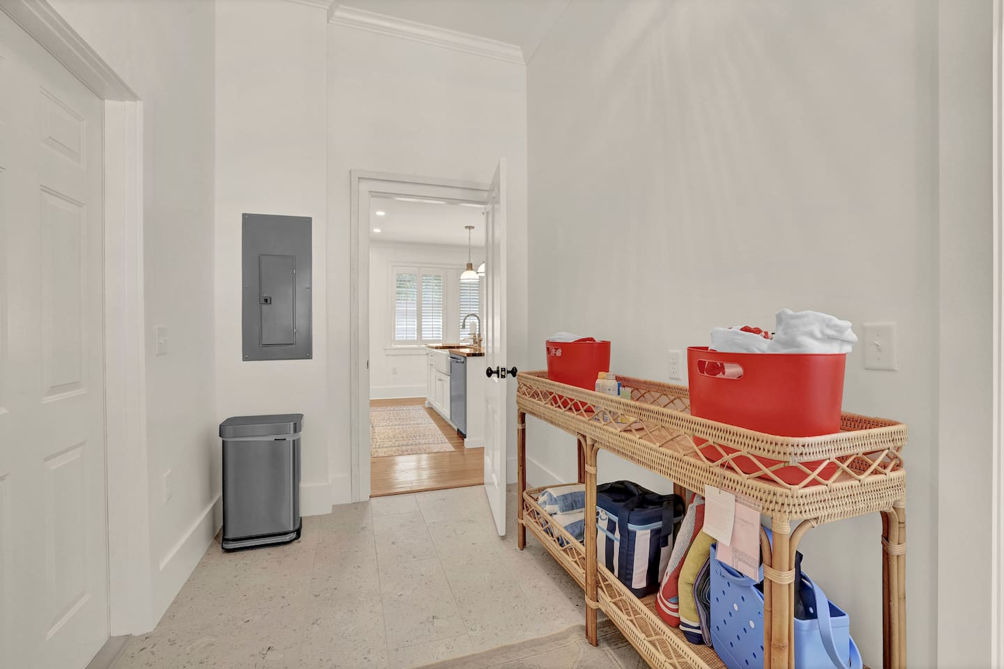 Beach gear in mudroom near laundry area