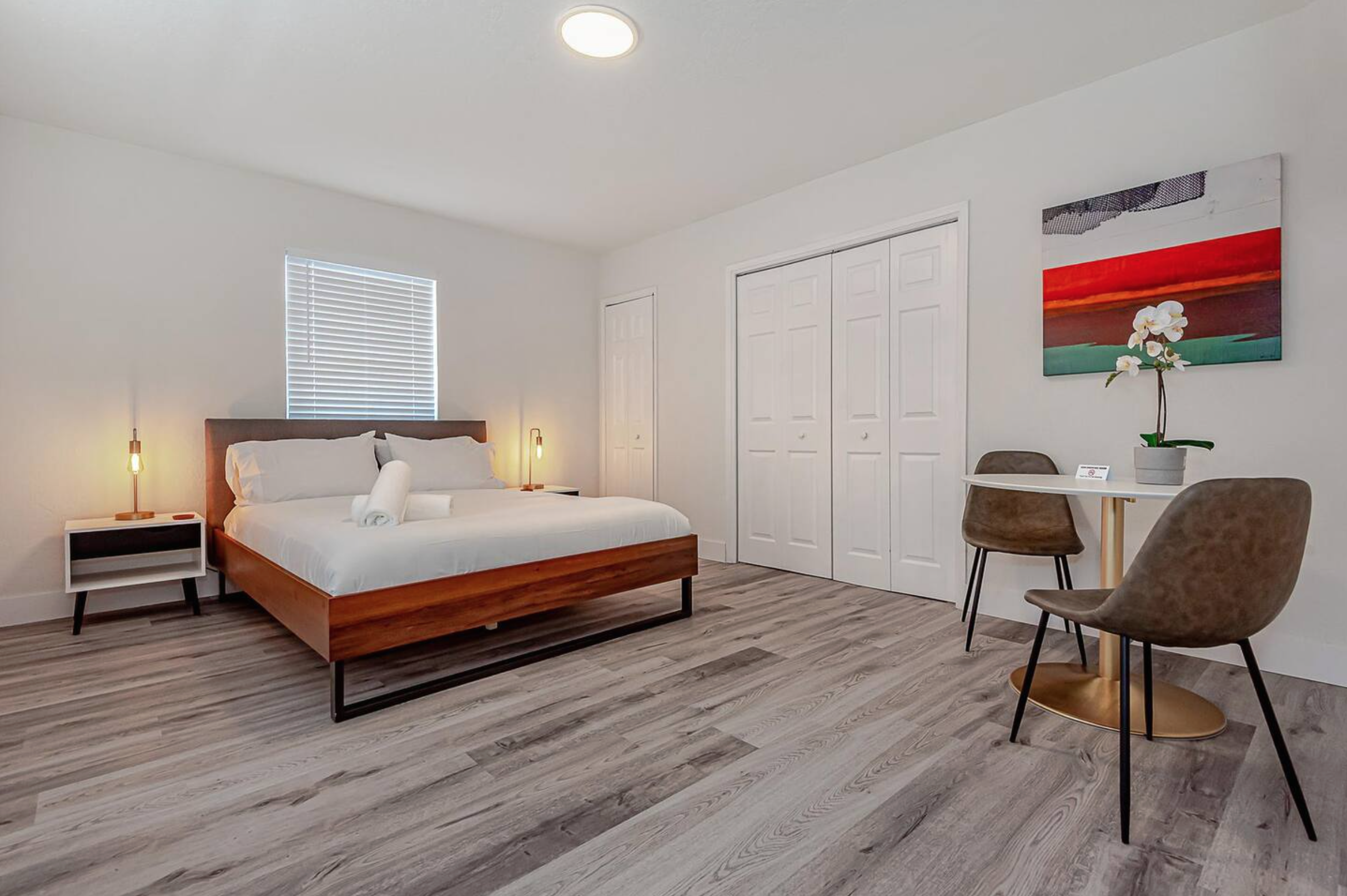 Welcome to your stylish, comfortable one-bedroom apartment, with a full kitchen, a queen bed in the private bedroom, and two twin beds in the main space.