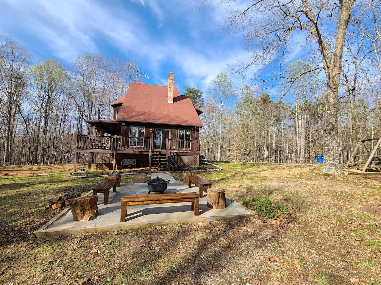 Outdoor Patio: Gather around the fire pit for starlit stories amidst serene woodlands!