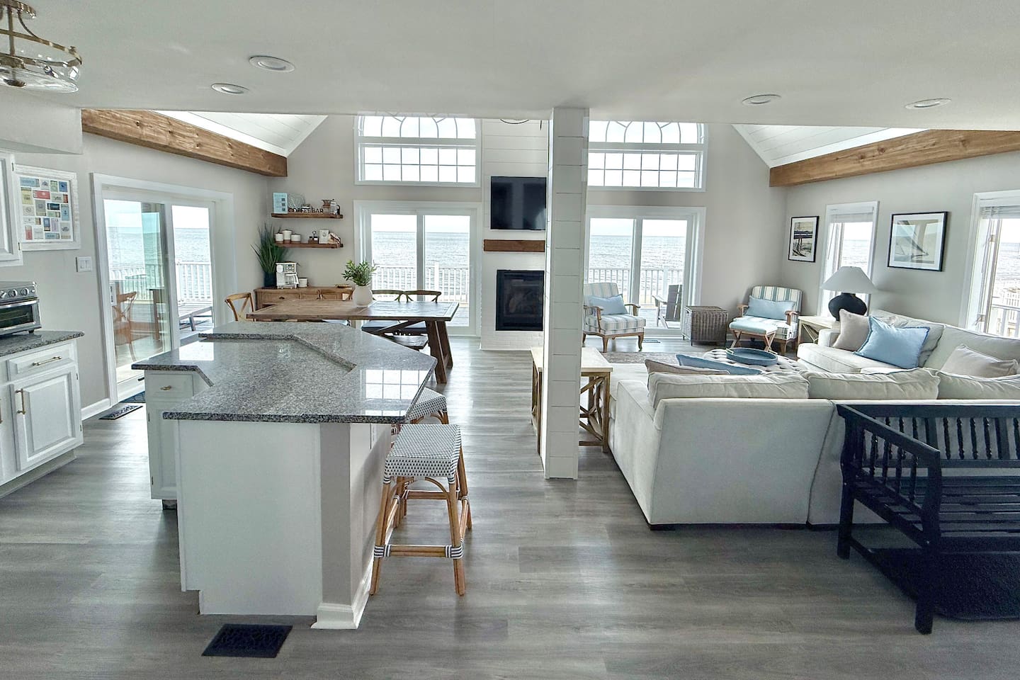 Enjoy the ultimate vacation in this expansive open-concept retreat. It is the perfect, light-filled space for friends and family to relax, share meals, and take in stunning panoramic ocean views.