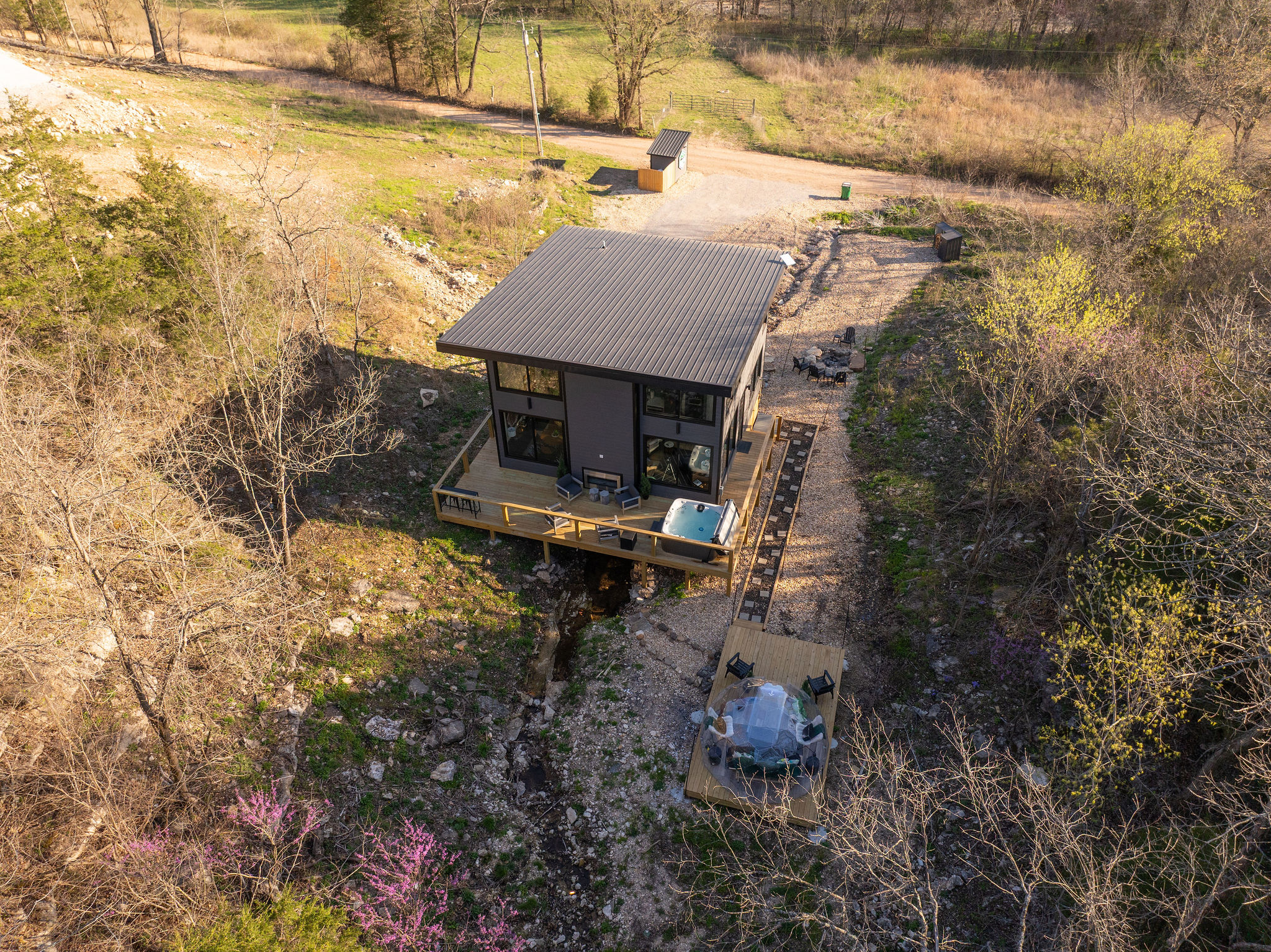 Property View: Enjoy the natural seclusion of the modern retreat and its private amenities, perfect for couples and small group getaways