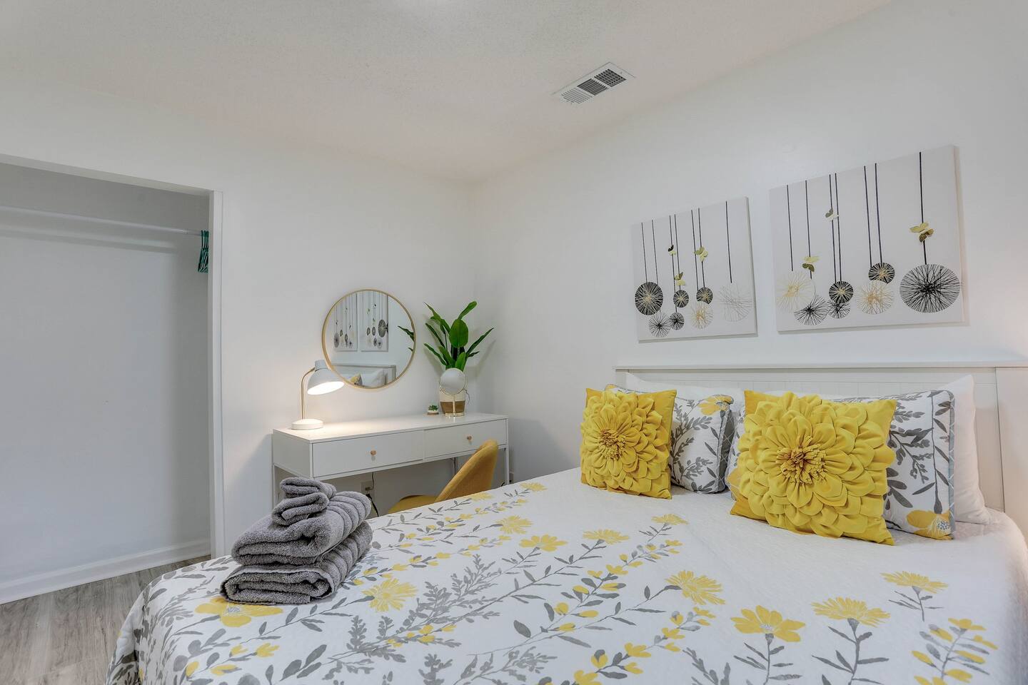 Unwind in the third bedroom, featuring a comfortable queen bed, a convenient desk for work or planning your day, and extra pillows for added comfort.